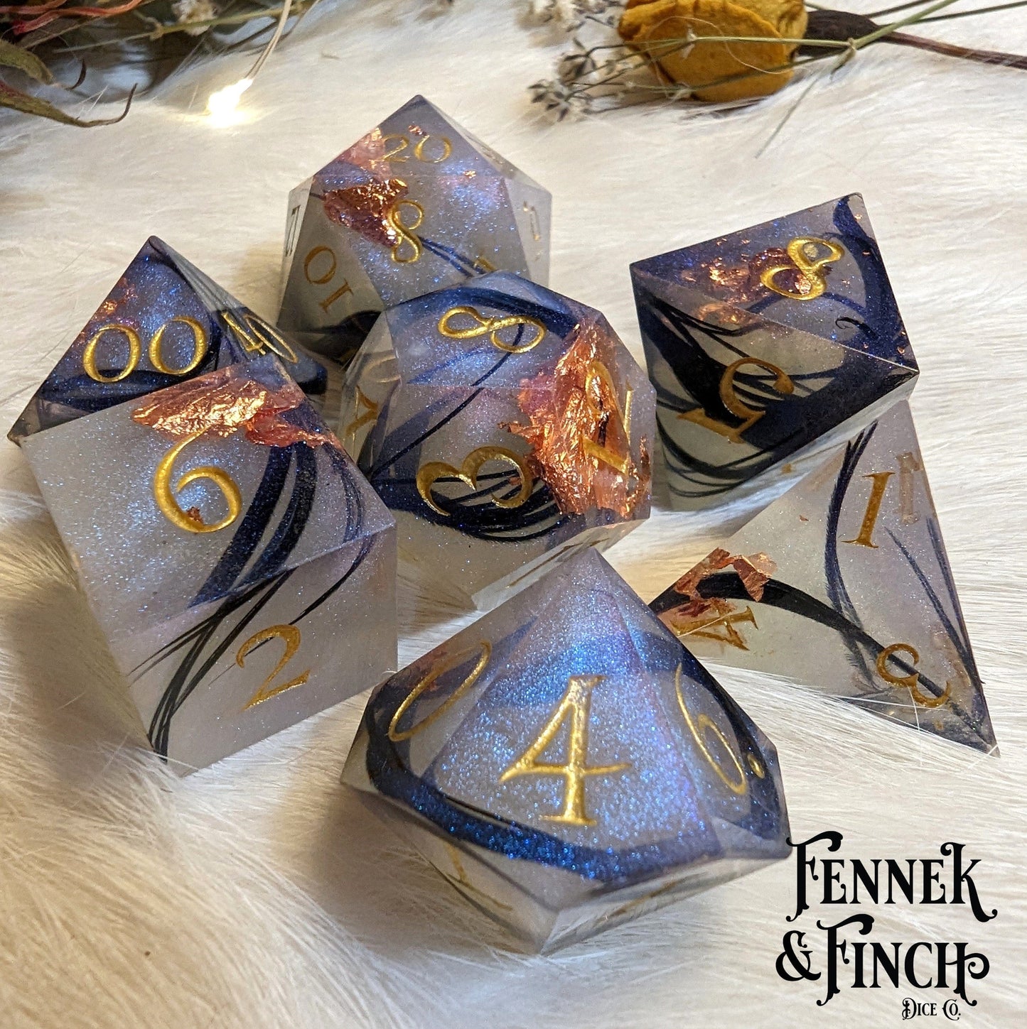 Feather Fall sharp edge dice set with black feathers, copper foil, and misty effect for DnD and other tabletop games.