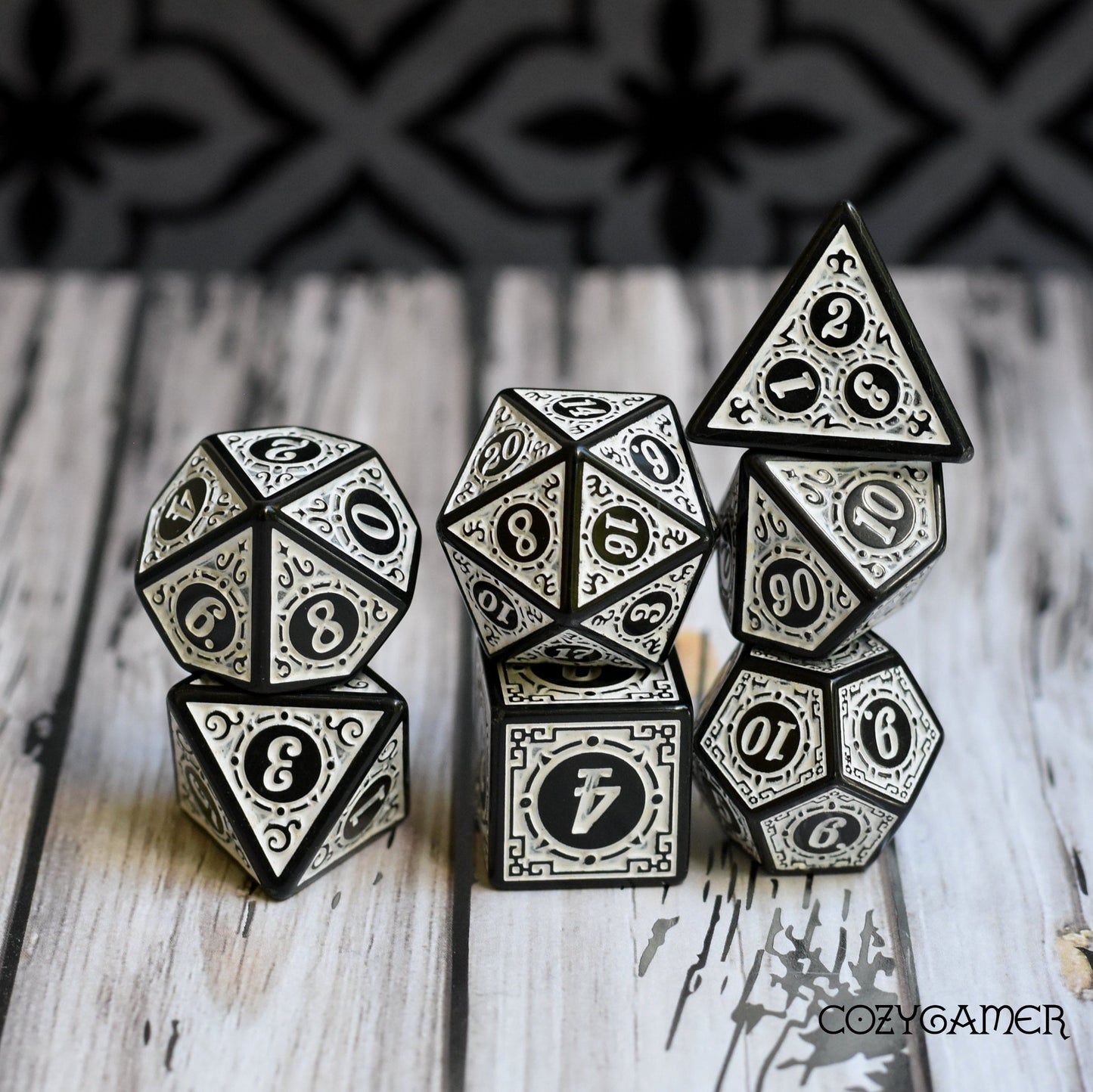 Elegant filigree framed 7-piece polyhedral dice set for Dungeons and Dragons, Magic The Gathering, and TTRPGs.