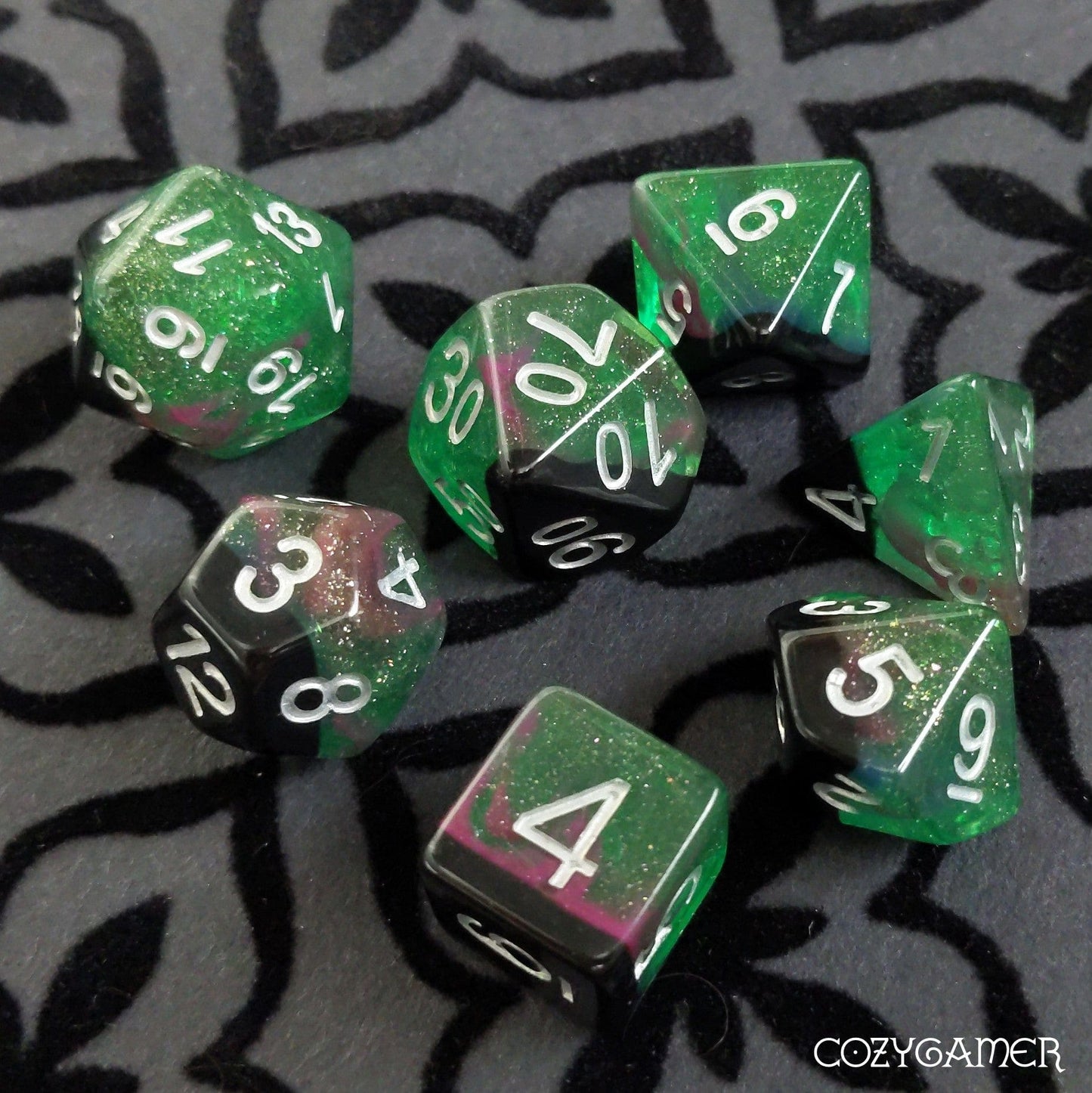 Forest Lights Dice Set in clear green resin with glitter and pink accents for tabletop games like Dungeons and Dragons.
