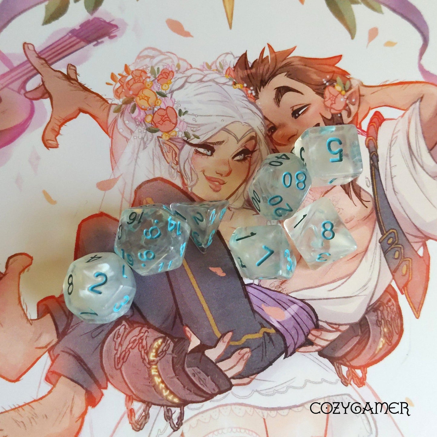 Frozen Heart Dice Set with blue numbers on clear acrylic, featuring artwork backdrop of two characters with flowers and instruments.