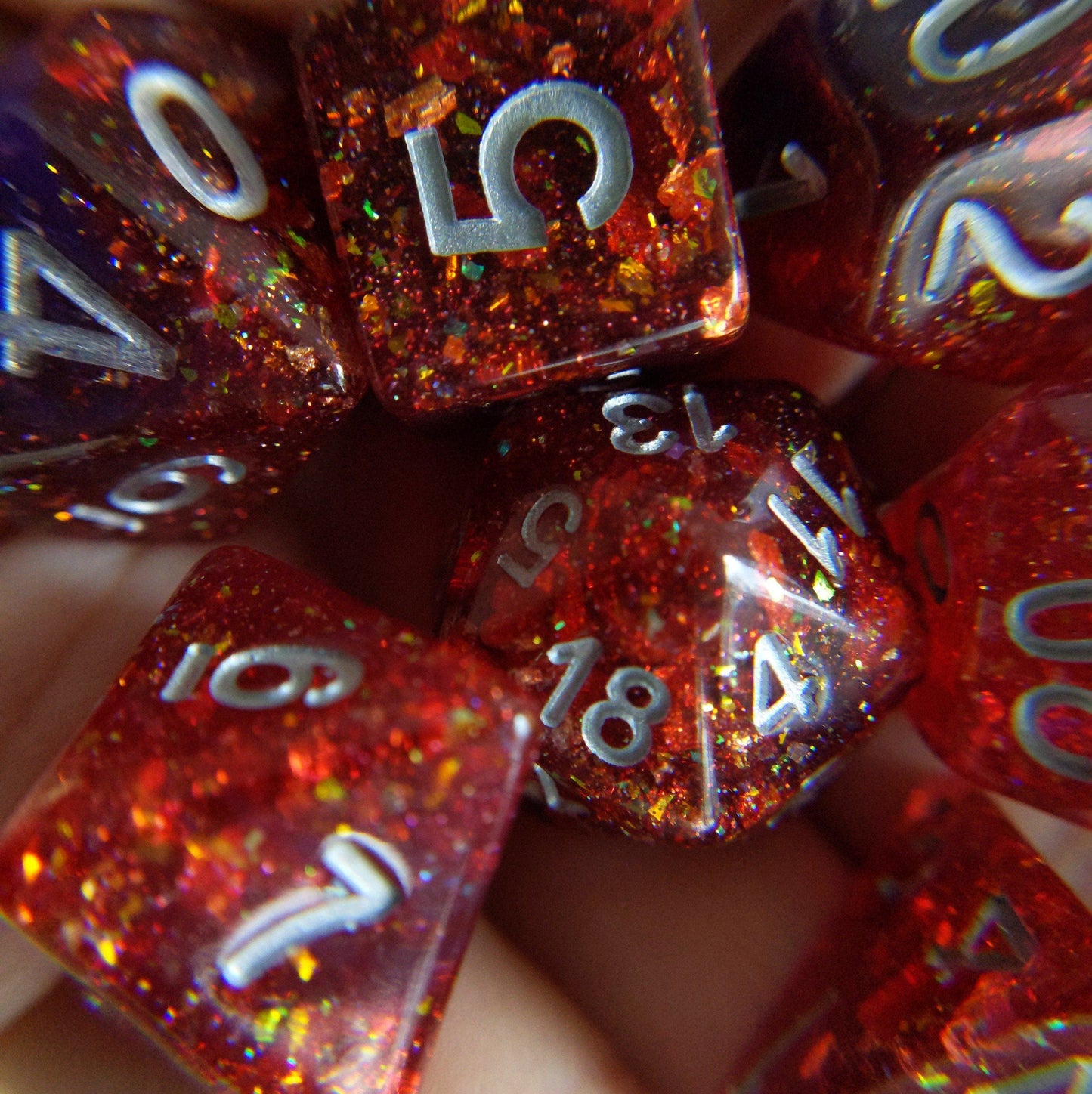 Gambit Dice Set with red and purple polyhedral dice, featuring opal flakes and gold foil, perfect for Dungeons and Dragons.