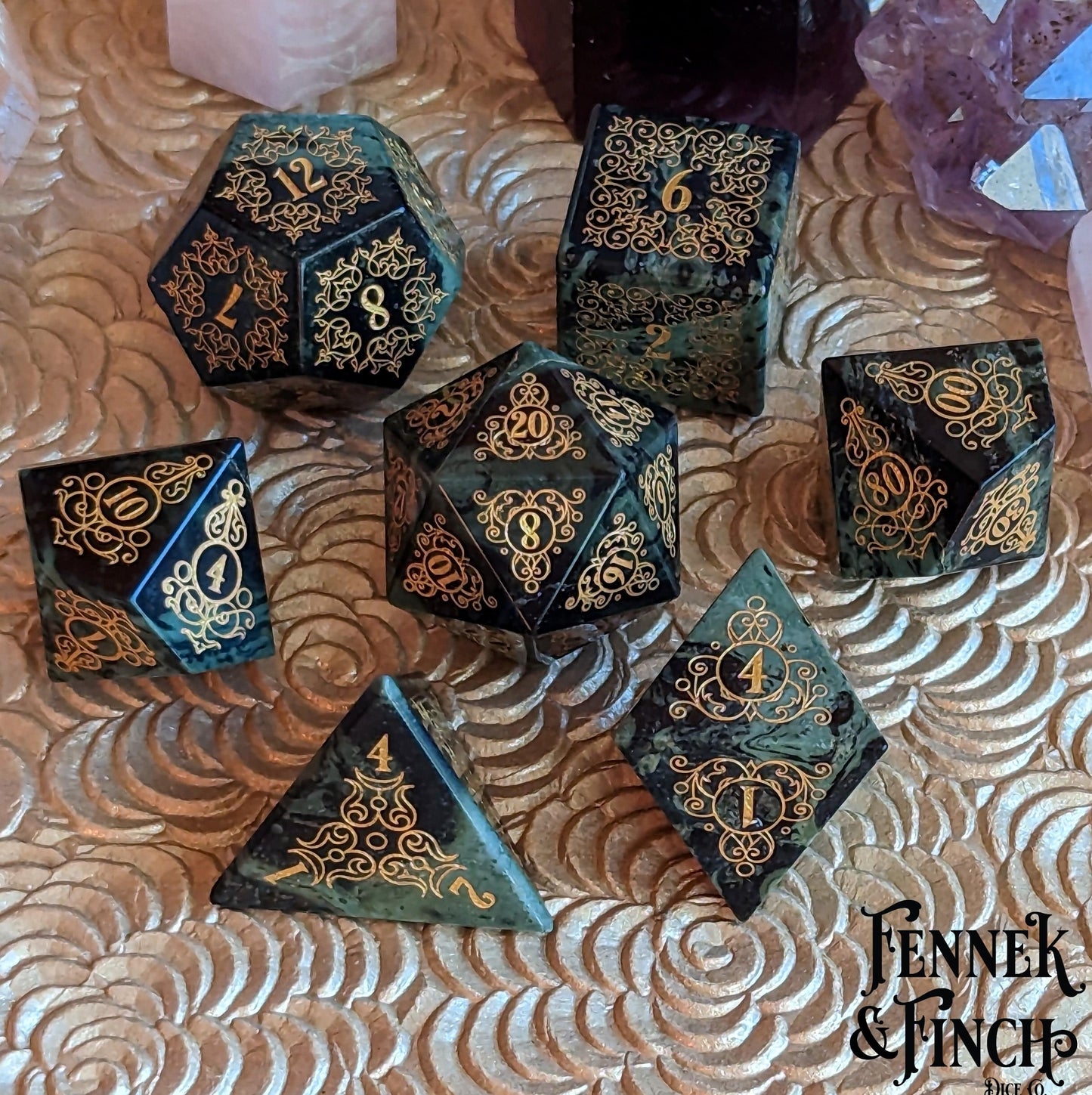 Garden Gate green jasper dice set with intricate gold engravings, inspired by nature's patterns and delicate designs.