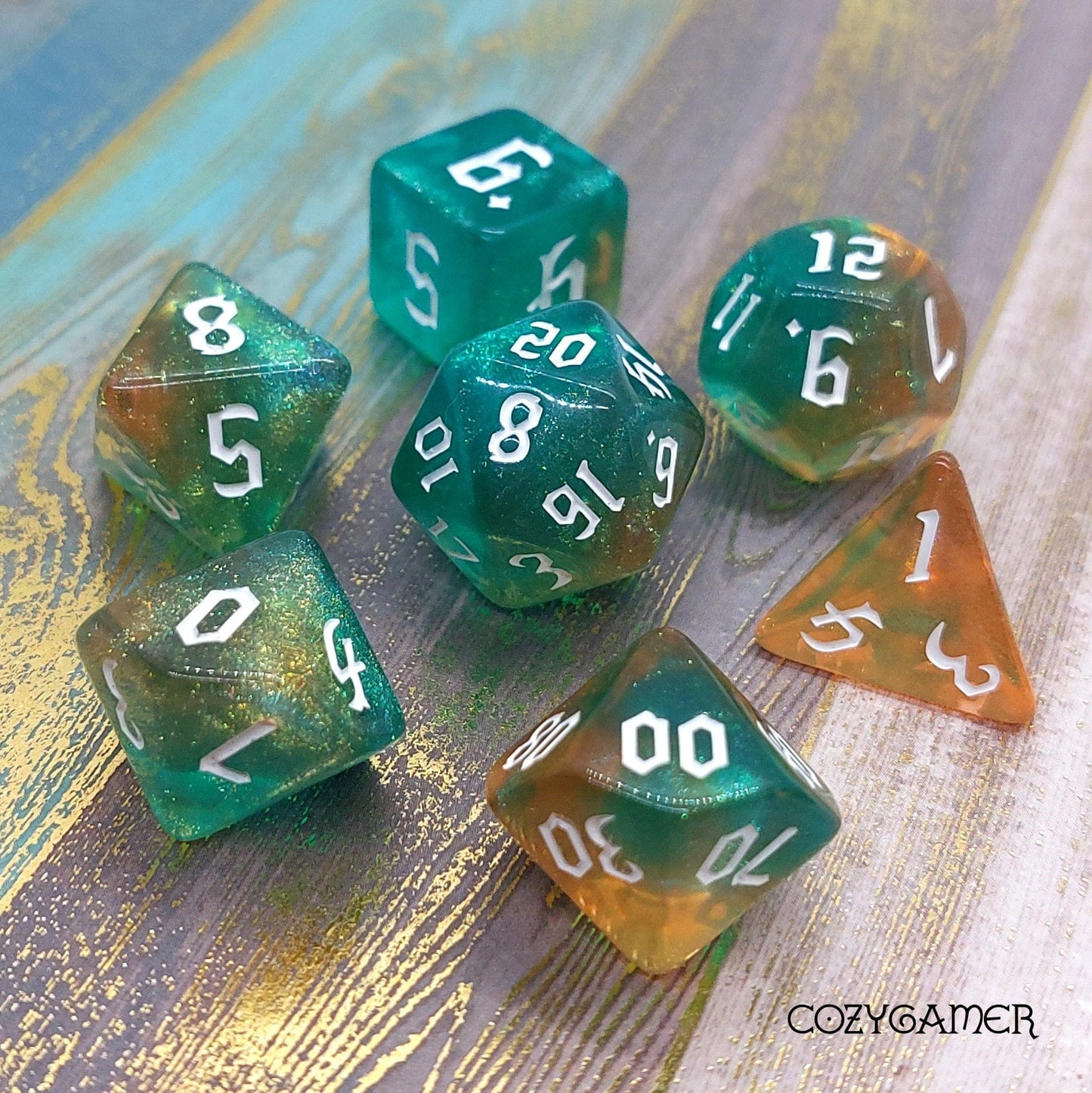 Marbled blue and orange Geyser Bolt 7-piece polyhedral dice set for tabletop RPGs like Dungeons and Dragons.