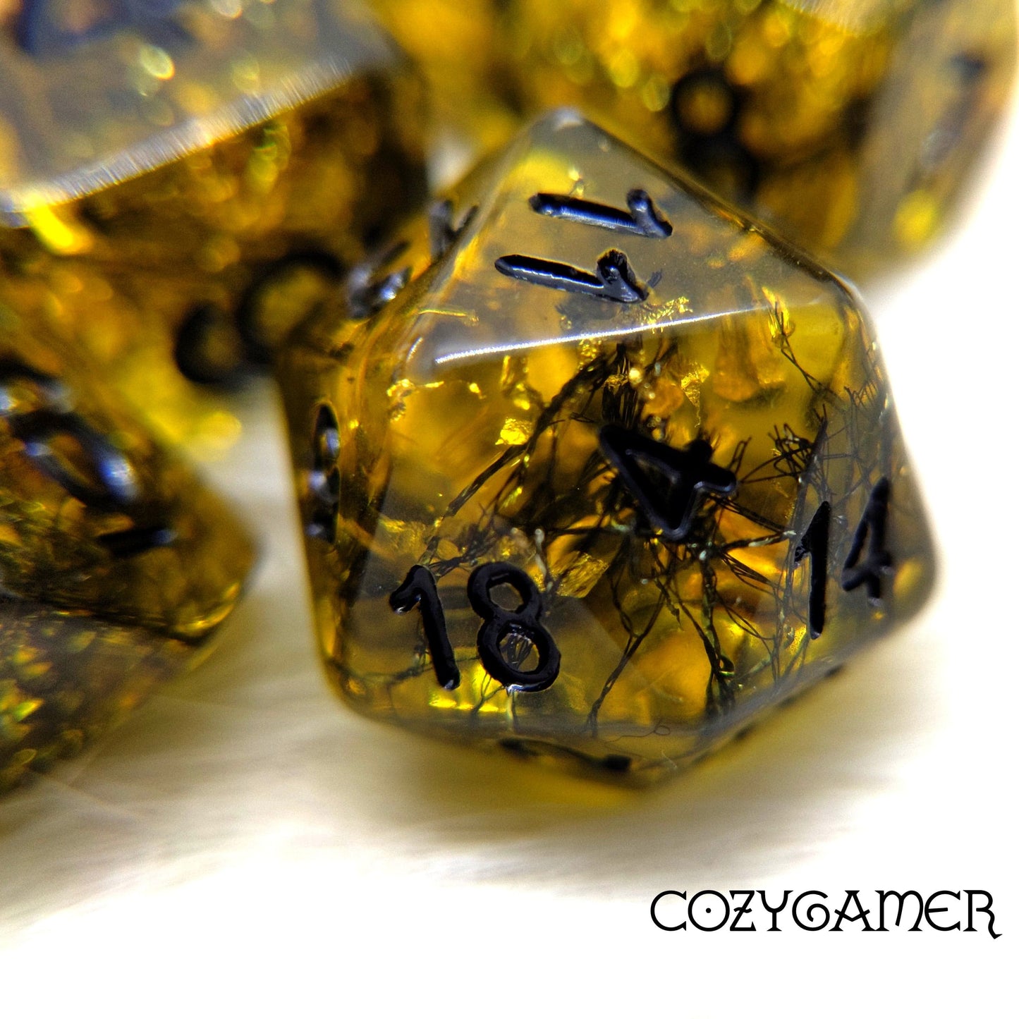Gilded Web Dice Set. 7 Piece Black shimmering threads and gold foil