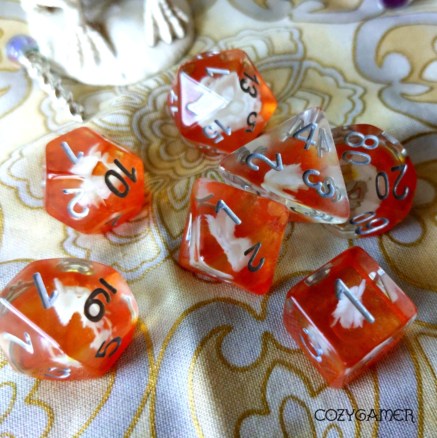 Golden Swan Lake TTRPG dice set with white swans and gold details, seven-piece polyhedral resin dice for Dungeons and Dragons gaming.