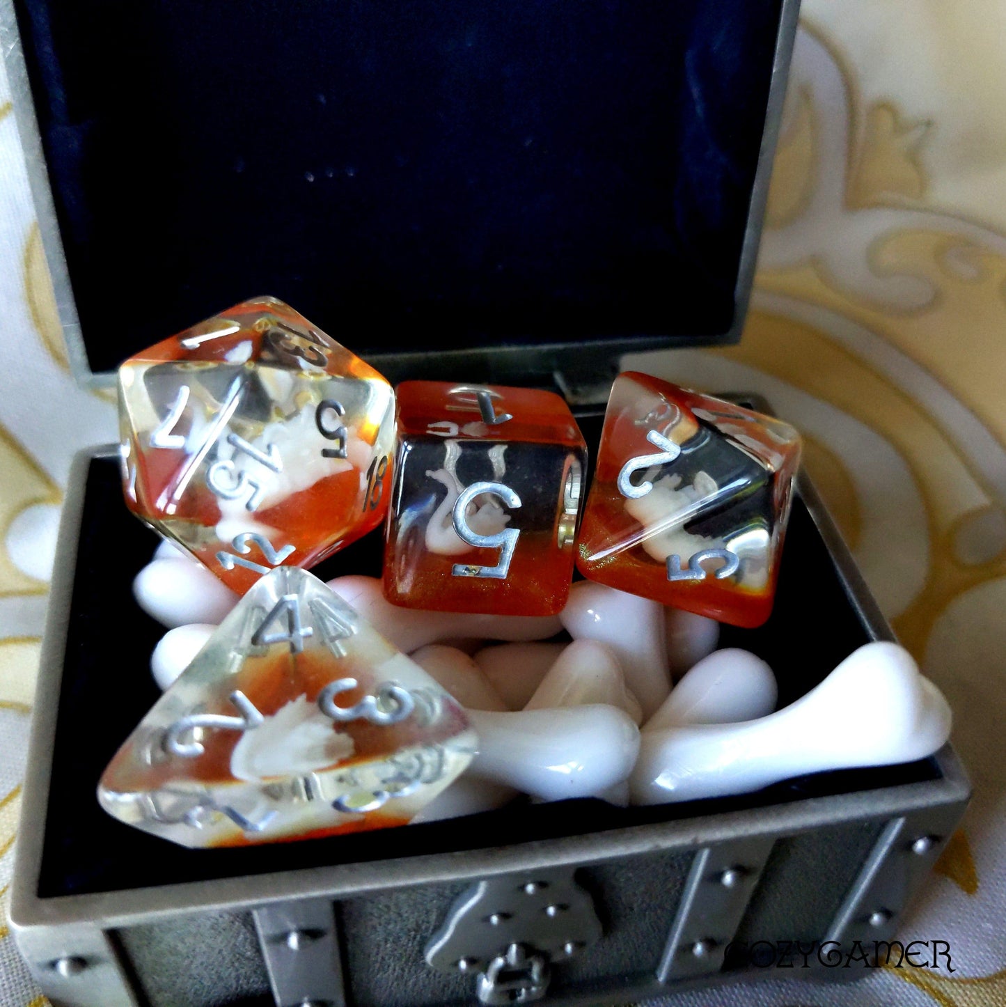 Golden Swan Lake Dice Set with white swans in a treasure chest, perfect for TTRPGs like Dungeons and Dragons, featuring 7 polyhedral dice.