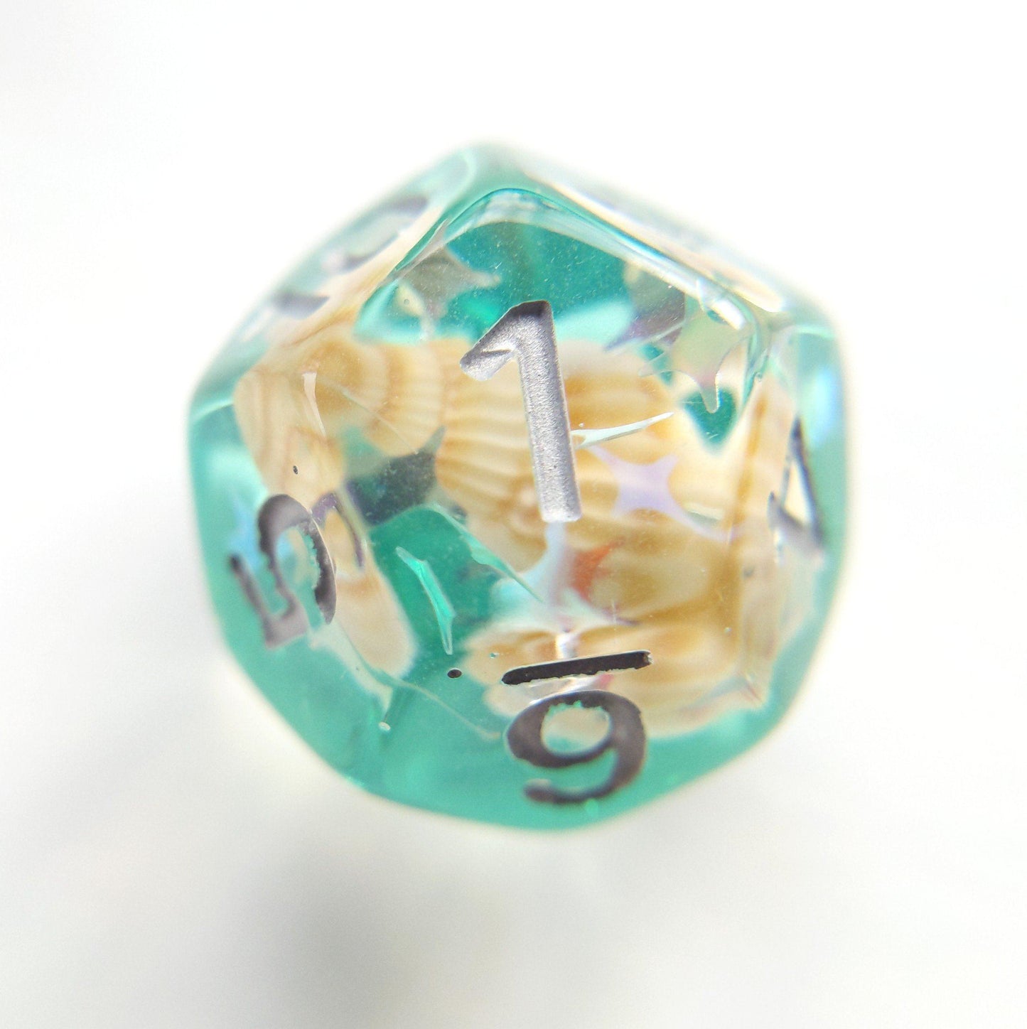 Green conch polyhedral dice with real seashell and glitter for tabletop RPGs