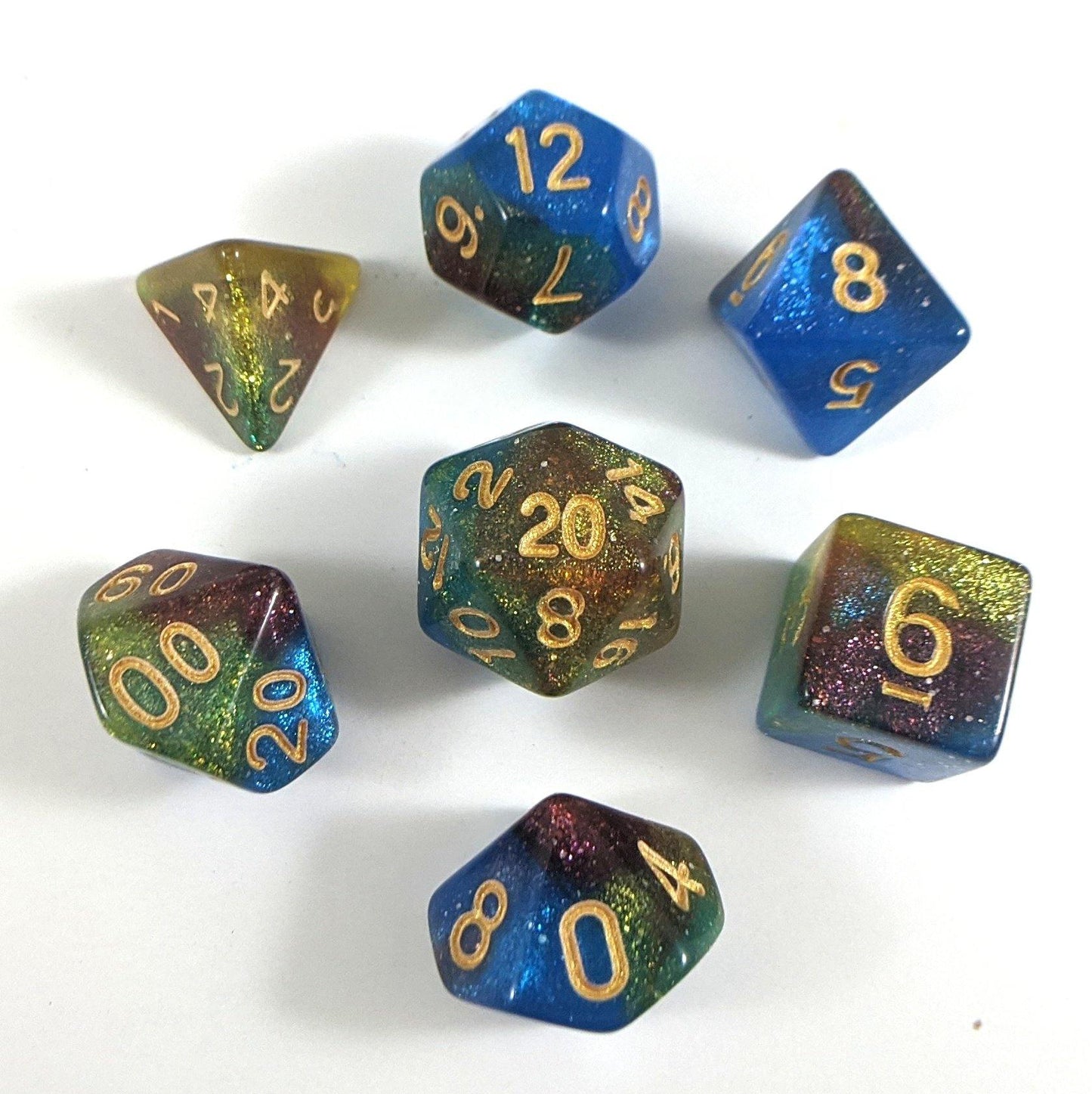 Helix Nebula Dice Set. Blue, Yellow, and Red Marbled Micro Shimmer Dice sets Fennek and Finch