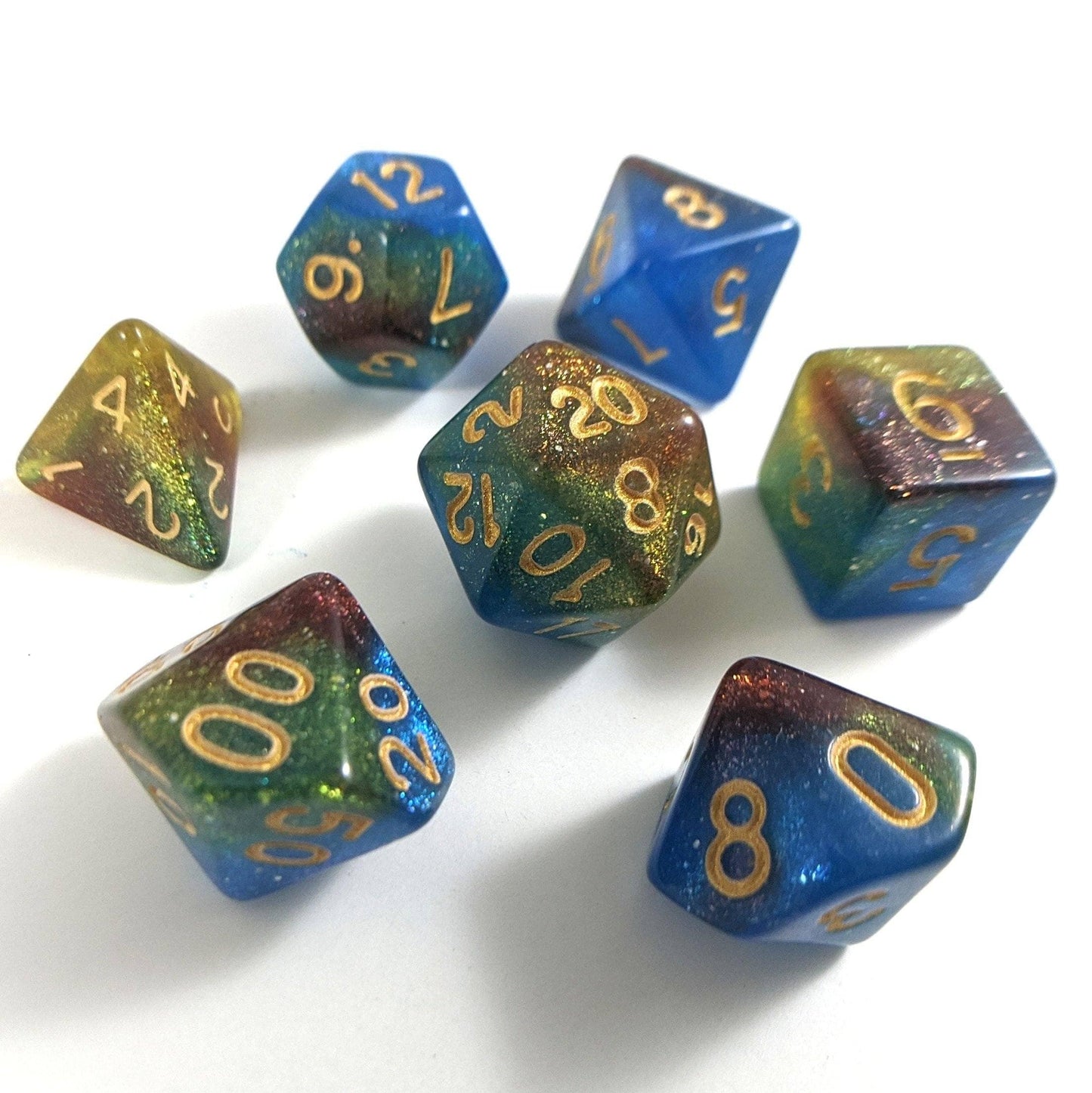 Helix Nebula Dice Set. Blue, Yellow, and Red Marbled Micro Shimmer Dice sets Fennek and Finch