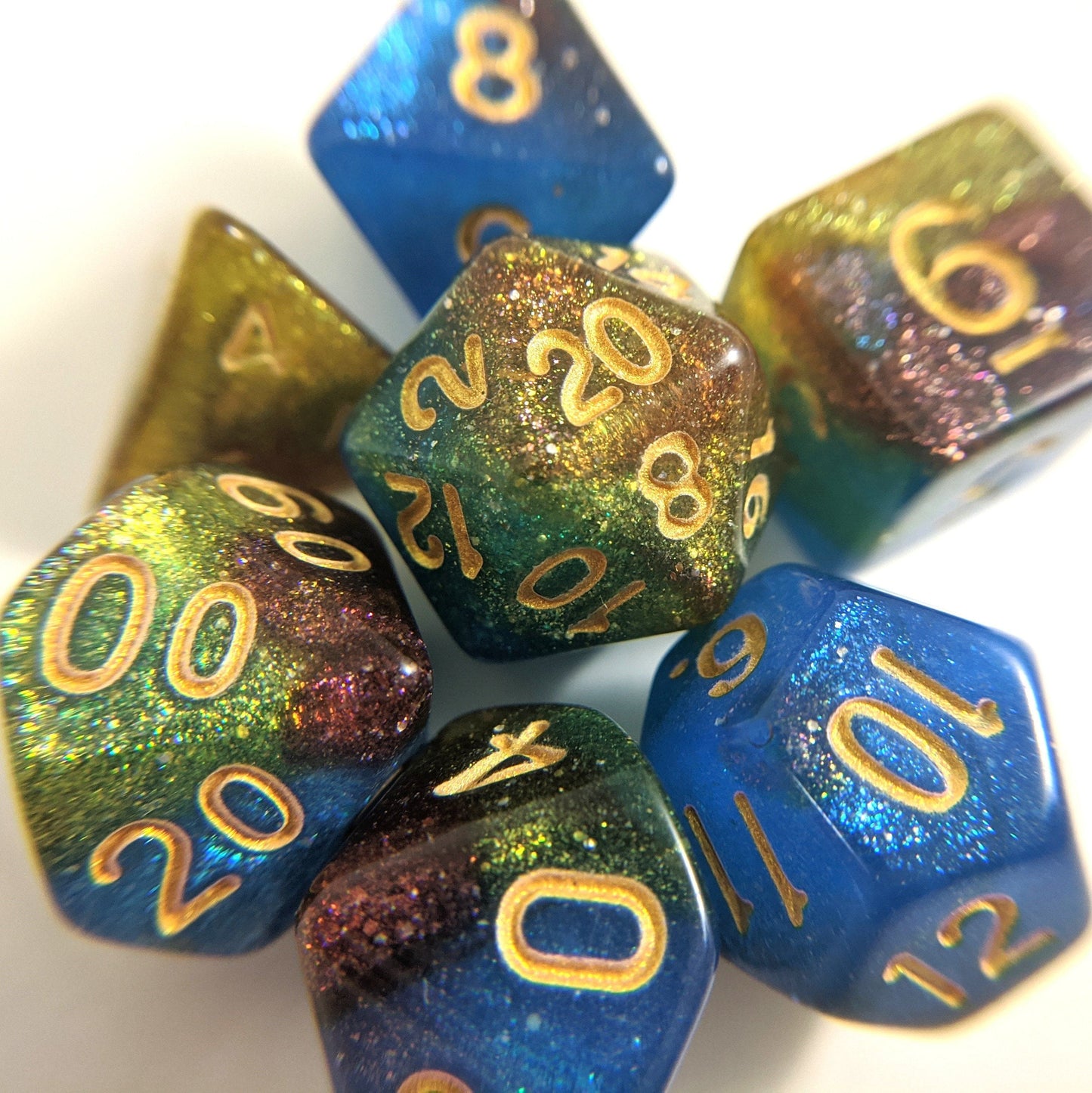 Helix Nebula Dice Set. Blue, Yellow, and Red Marbled Micro Shimmer Dice sets Fennek and Finch