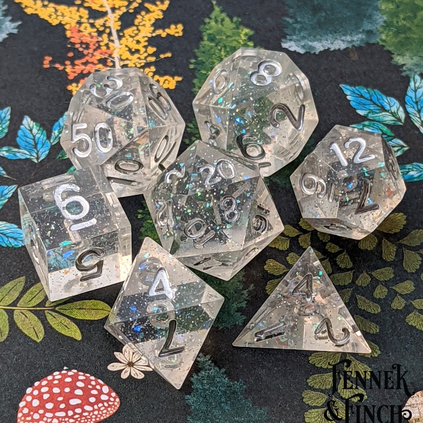Ice Palace Sharp Edge Dice Set. Clear resin with tiny opal flakes and silver font.