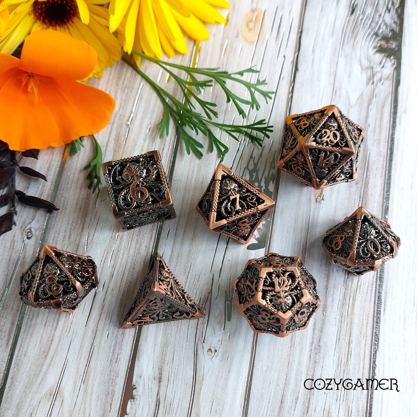 Kraken Hollow Metal Dice Set with intricate kraken design, perfect for Dungeons & Dragons and tabletop RPGs, displayed on wooden surface.