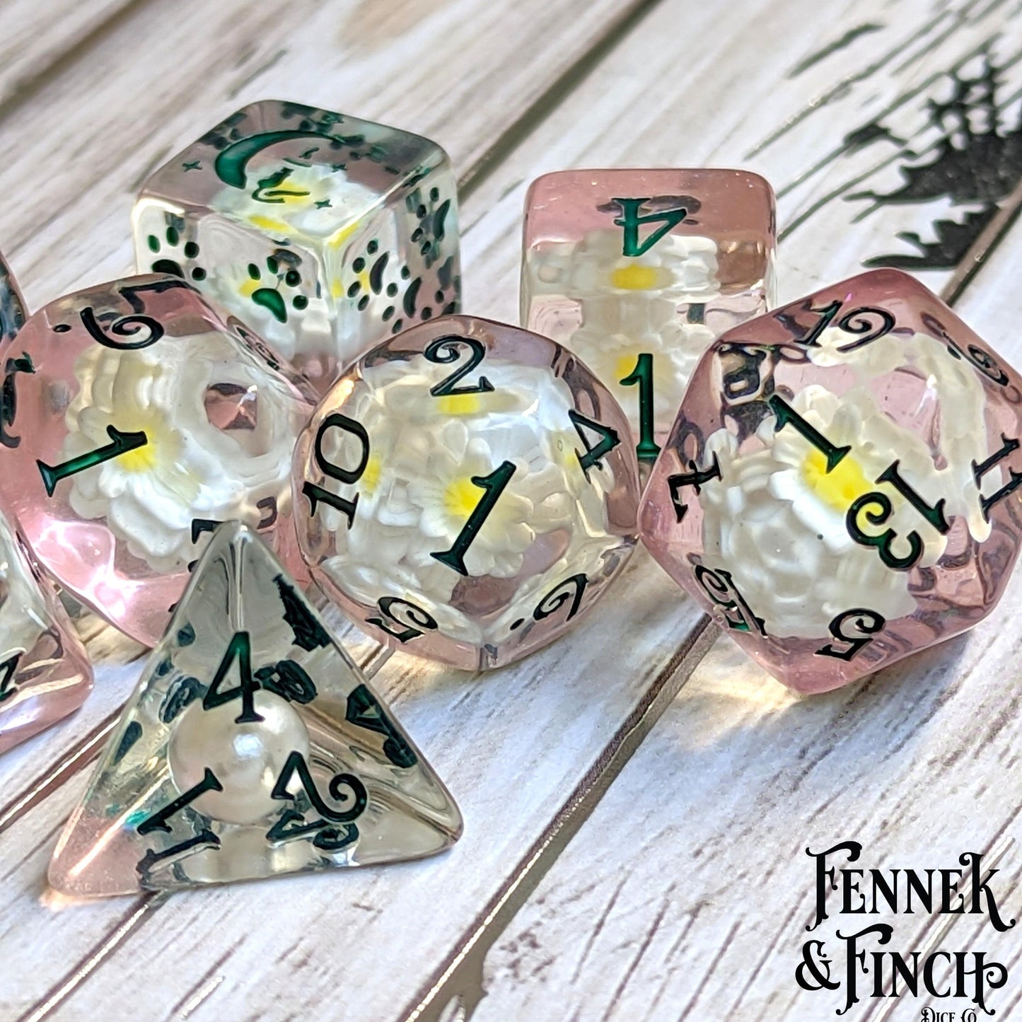 Lily Dice Set with faux flowers and glitter, featuring a cat wizard on D6, perfect for DND tabletop games.