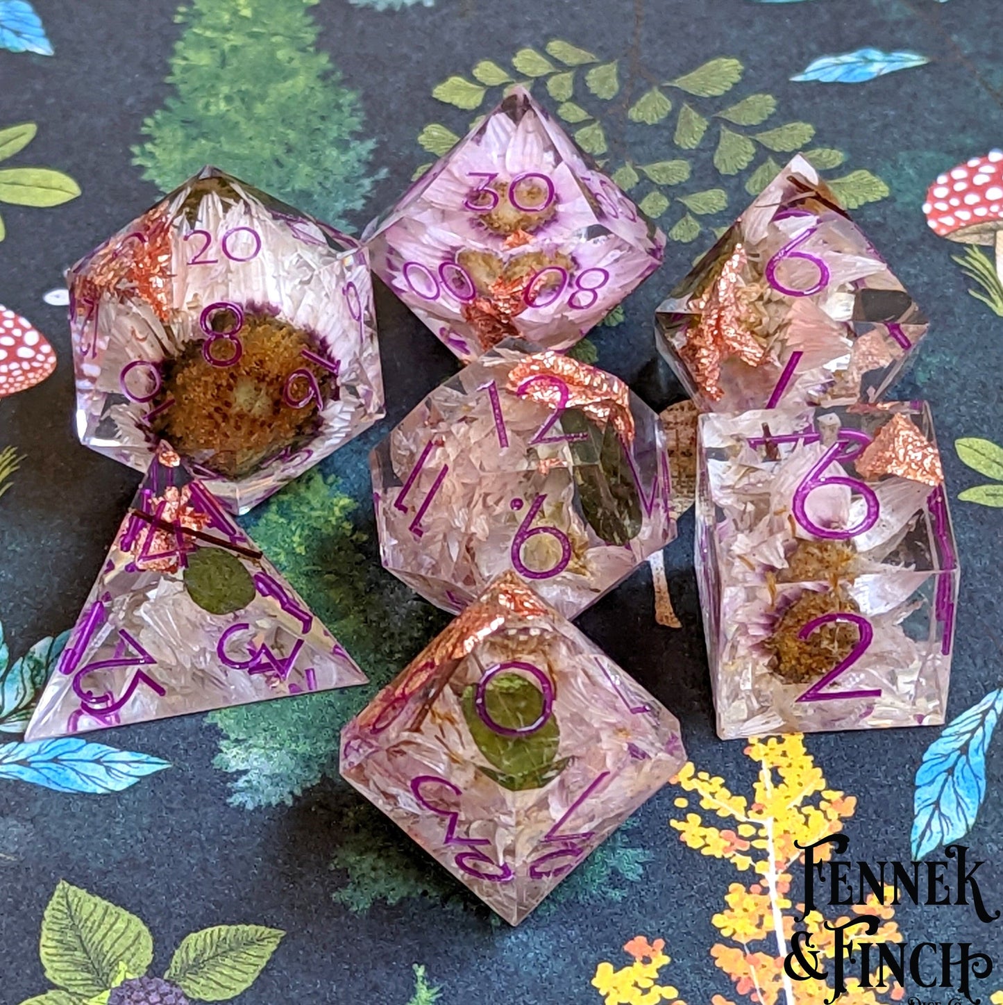Magenta Ink Daisy DnD Dice Set with resin finish, featuring daisies and copper foil on a decorative background.