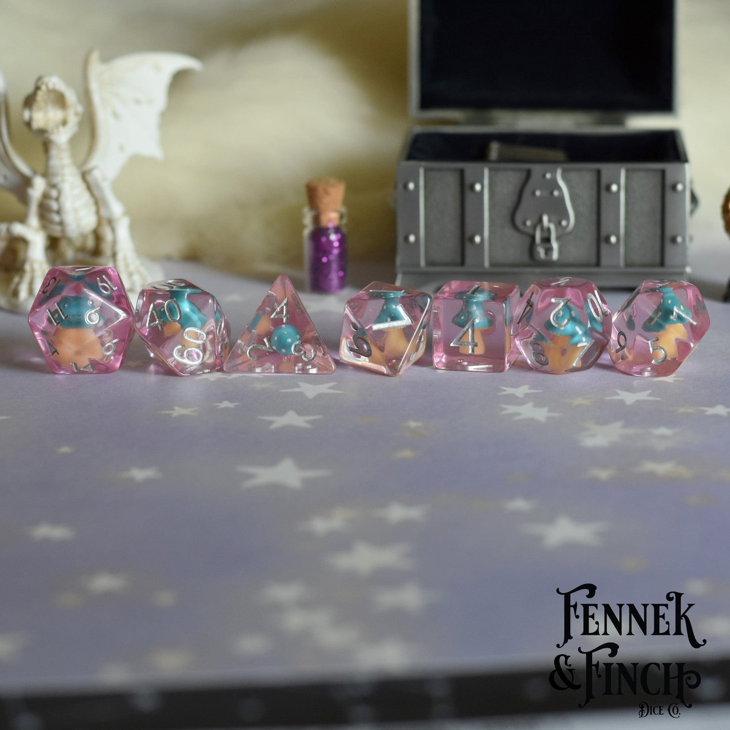 Magic Mushroom Dice Set with tiny blue Amanita mushrooms in clear purple resin for tabletop games like Dungeons and Dragons.
