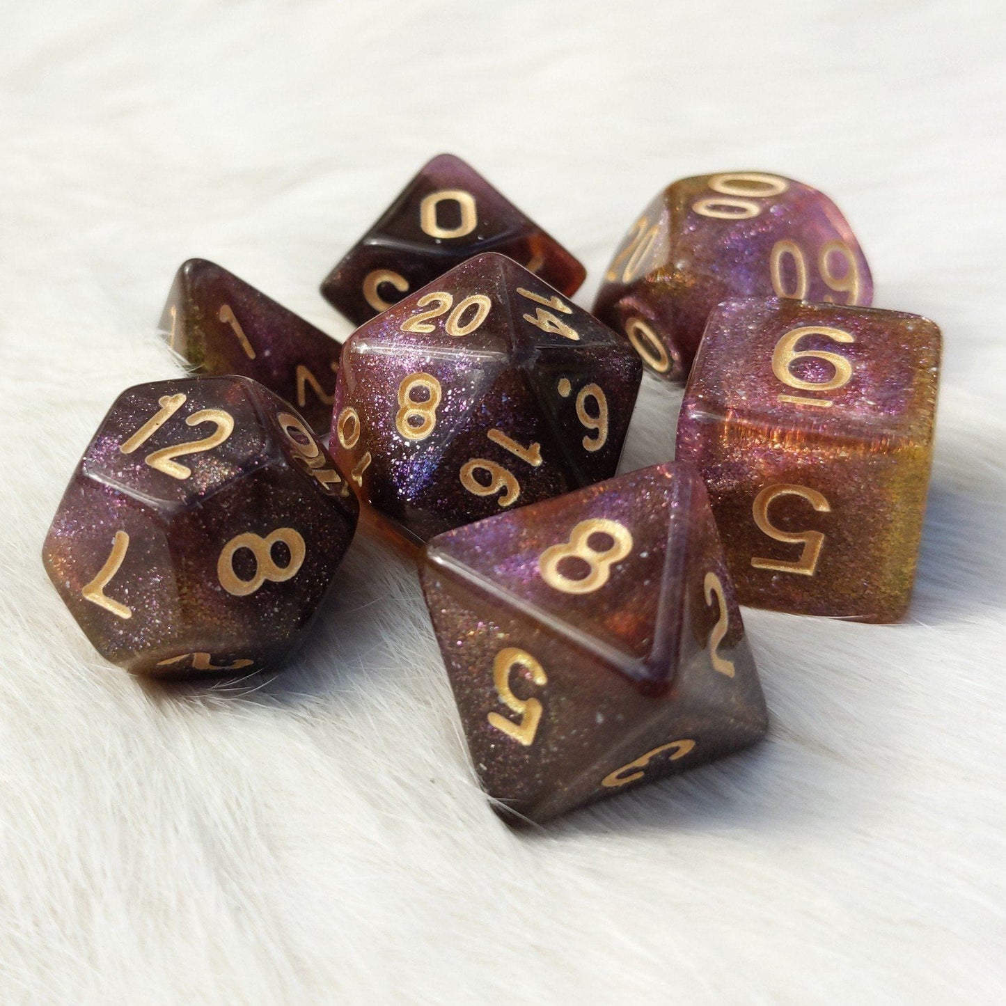 Mimic Dice Set with micro shimmer in purple, yellow, and brown hues, featuring pale gold font, for tabletop RPGs like DnD.