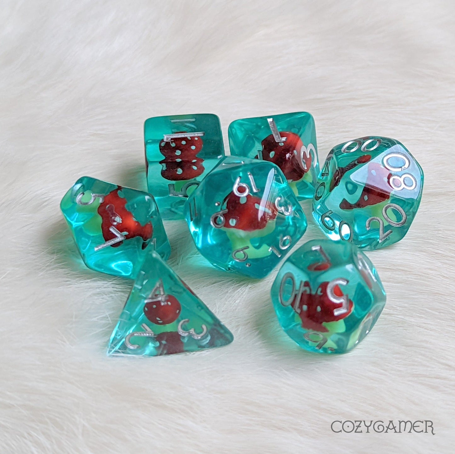 Blue Mushroom Tea Dice Set with tiny amanita design for role-playing games like Dungeons and Dragons. 7 piece polyhedral set.