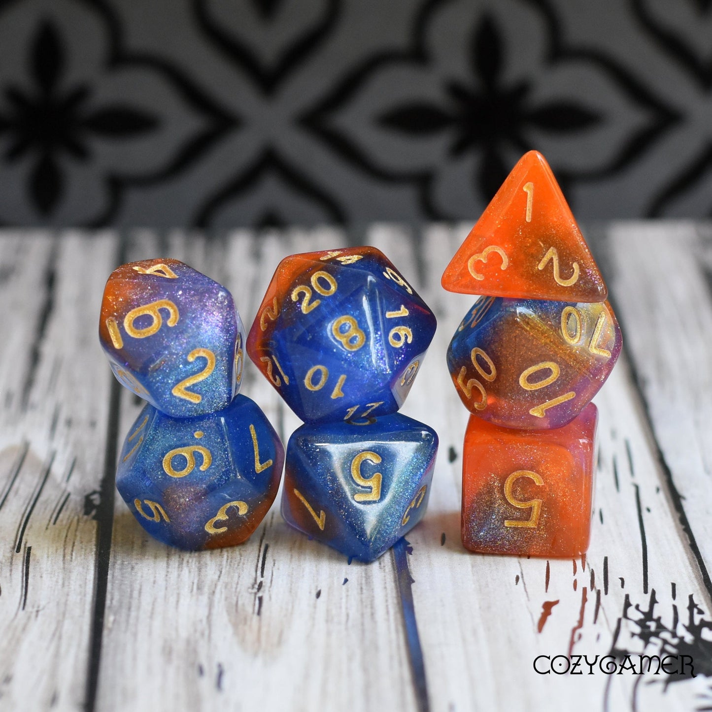 Nebula Dice Set with orange, blue, and pink marbled shimmer for Dungeons and Dragons and Magic The Gathering tabletop games.