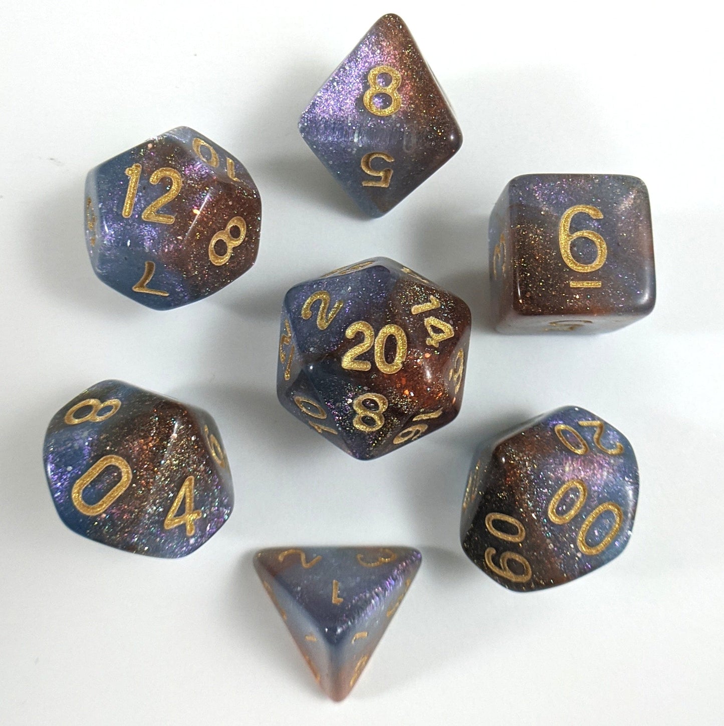 Orion Nebula Dice Set in lavender purple and maroon with micro shimmer, 7-piece polyhedral set for DnD and TTRPGs.