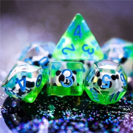 Panda Dice Set. Tiny black and white Pandas sitting on green