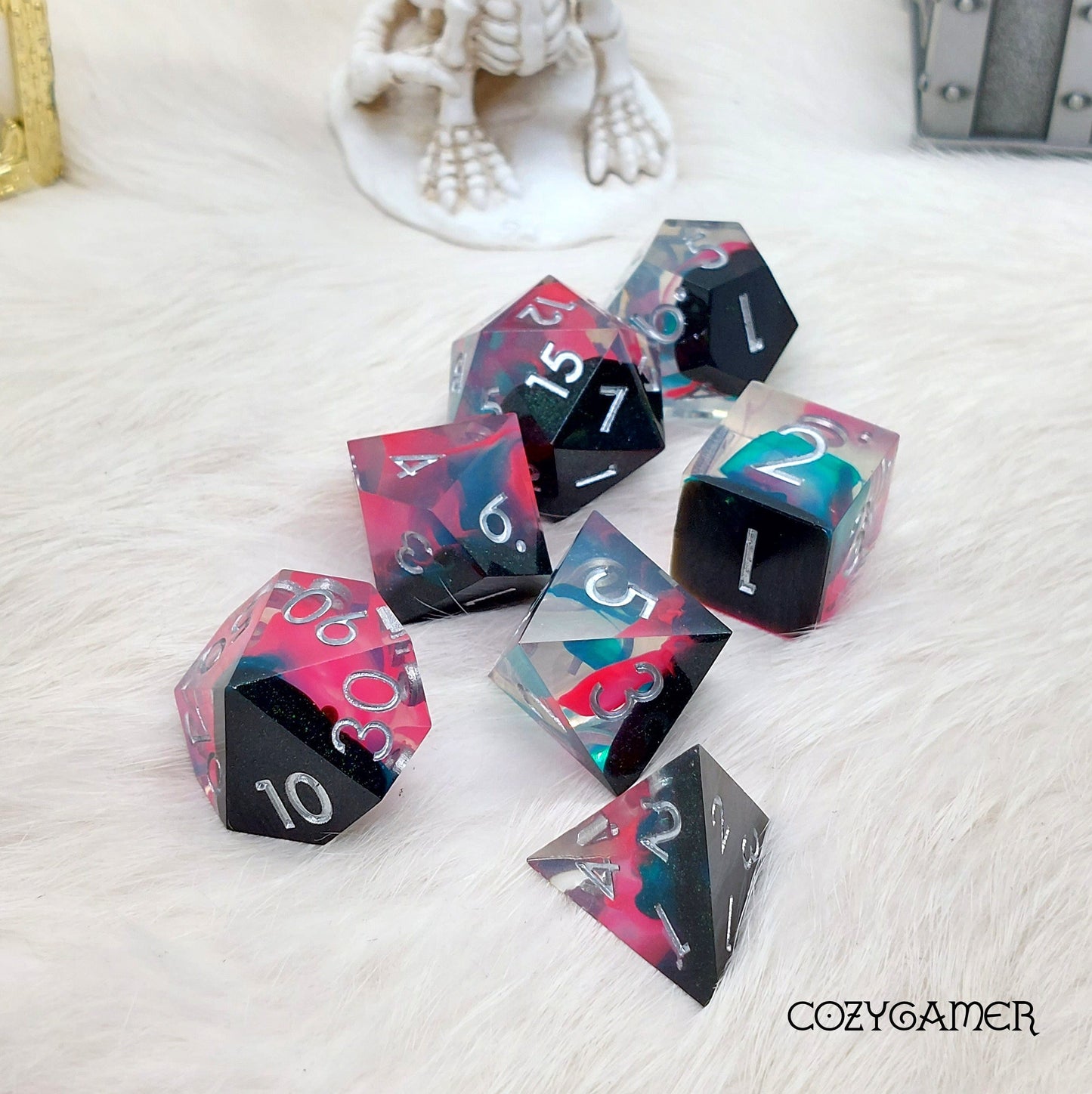 Perfect Weapon Sharp Edge Resin Dice Set with black, pink, and blue flames, 7-piece polyhedral TTRPG set for DND gaming.