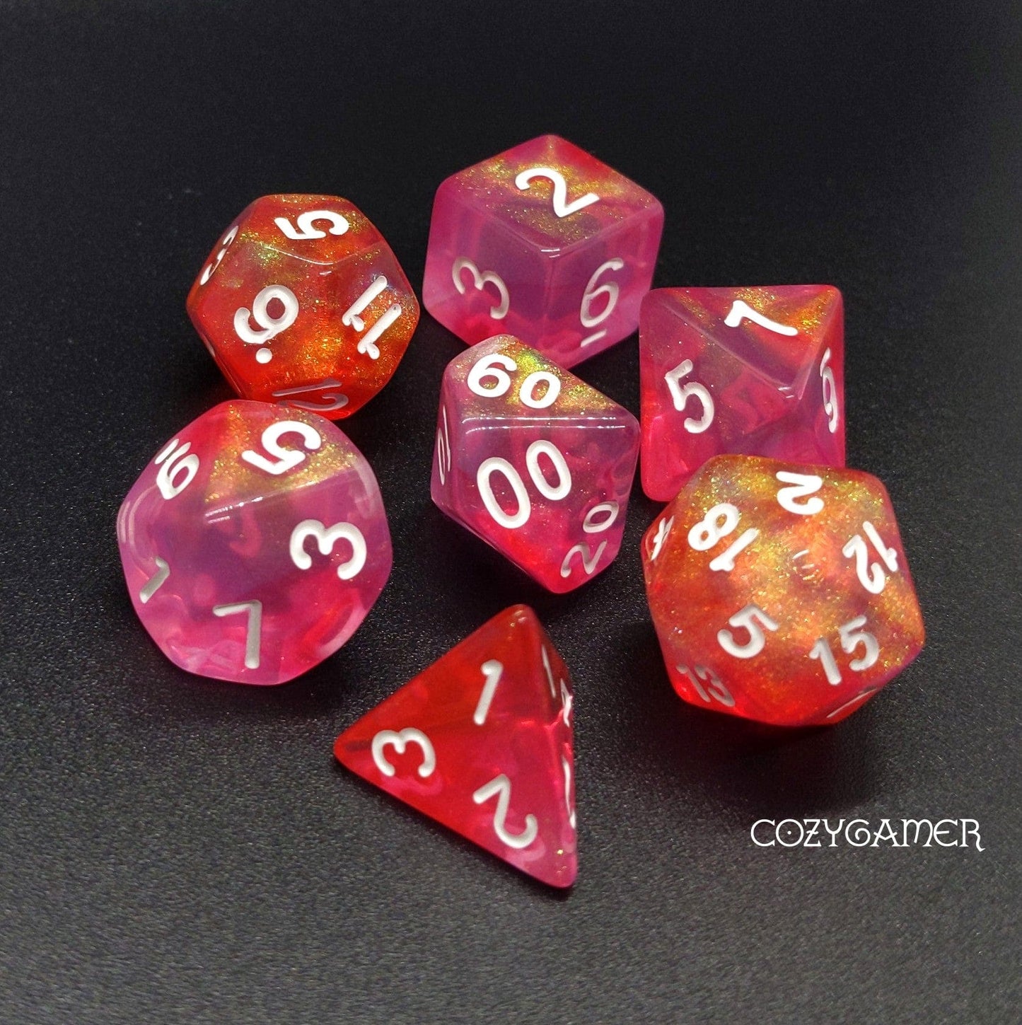 Pink Bunny Will O Wisp Dice Set with glittering pink and red acrylic polyhedral dice for TTRPGs like Dungeons and Dragons.