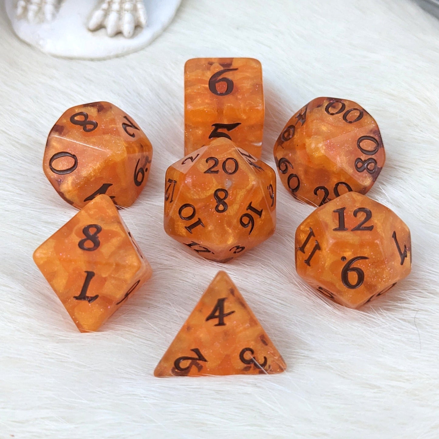 Pumpkin Pie orange DnD dice set with seven pieces, embodying autumn warmth and cozy vibes for tabletop adventures.