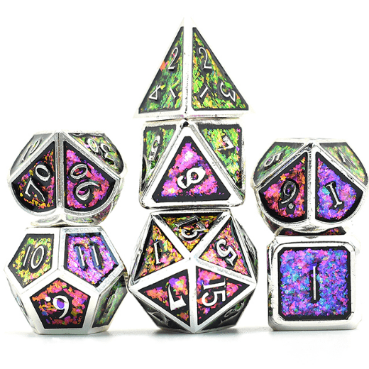 Purple and green glitter metal dice set with silver trim for tabletop RPGs, featuring 7 polyhedral dice including D20 and D4.