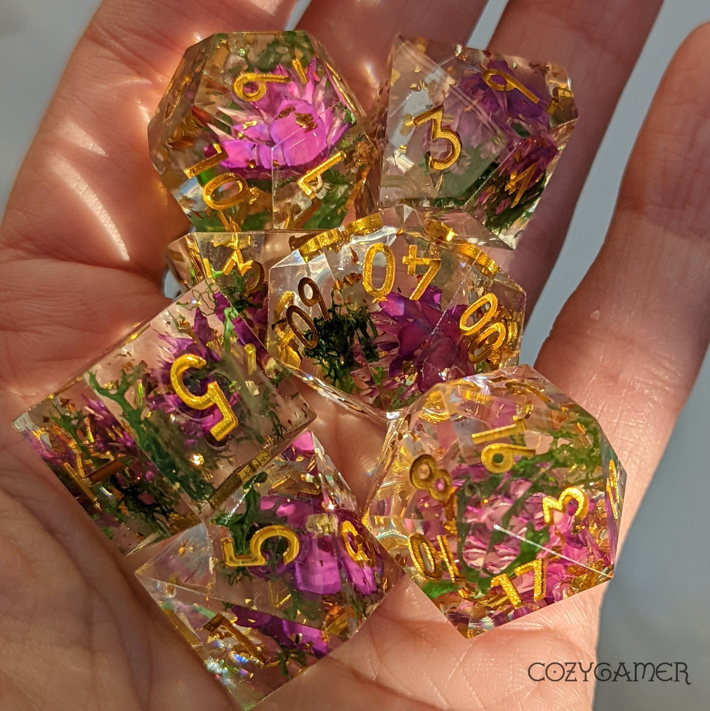 Purple Flowers and Green Moss Sharp Edge Resin Dice Set. 7 Piece DND dice set with real dried flowers. Dice Sets & Games Fennek and Finch