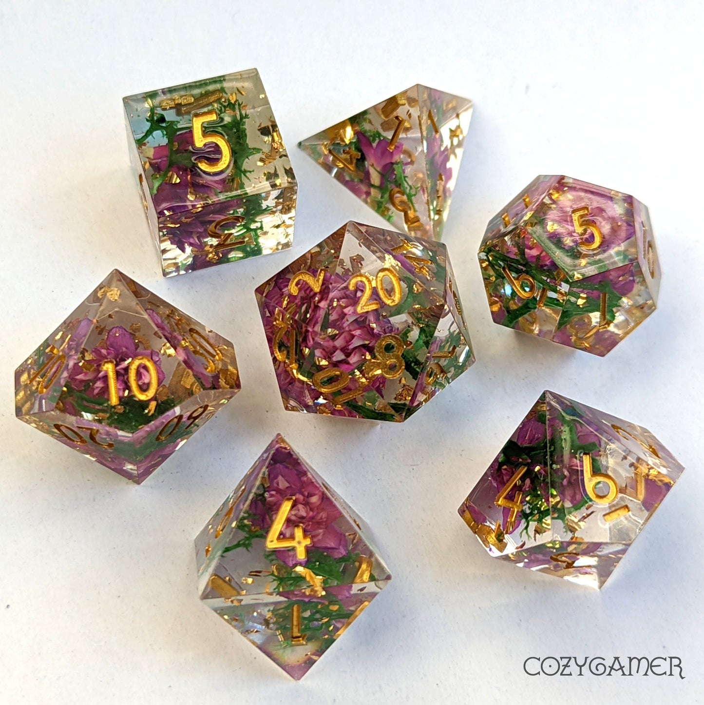 Purple Flowers and Green Moss Sharp Edge Resin Dice Set. 7 Piece DND dice set with real dried flowers. Dice Sets & Games Fennek and Finch
