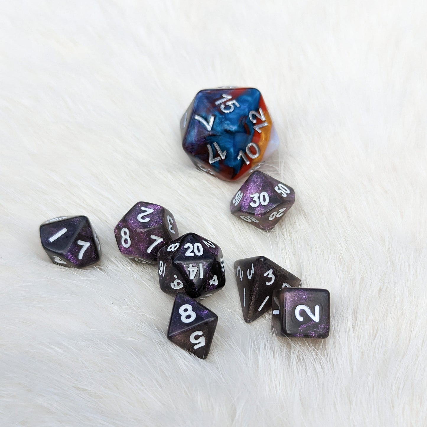 Purple Galaxy Mini Dice Set on white background, featuring small polyhedral DND dice in deep purple and black with a shimmering finish.