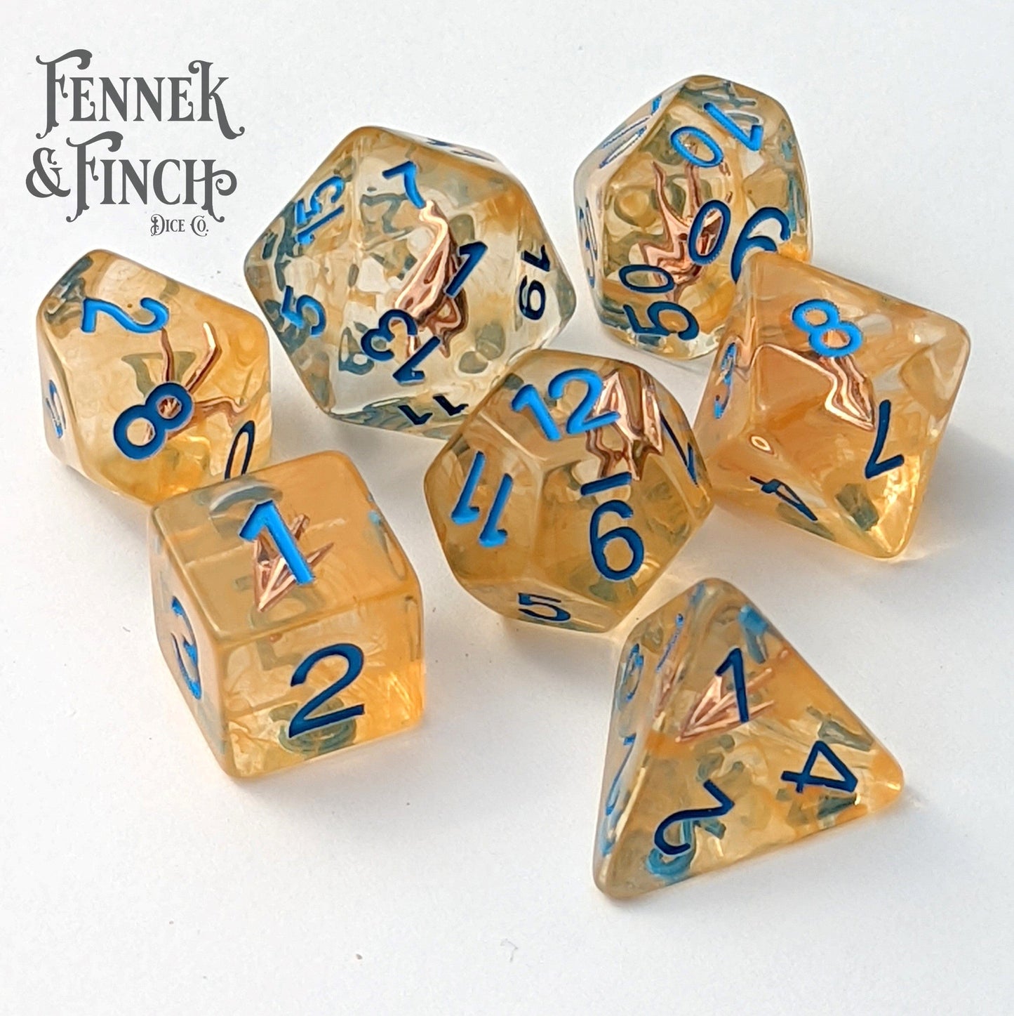 Ranger's Arrow Dice Set with golden resin and blue numbers, perfect for DnD role-playing games with a ranger theme.