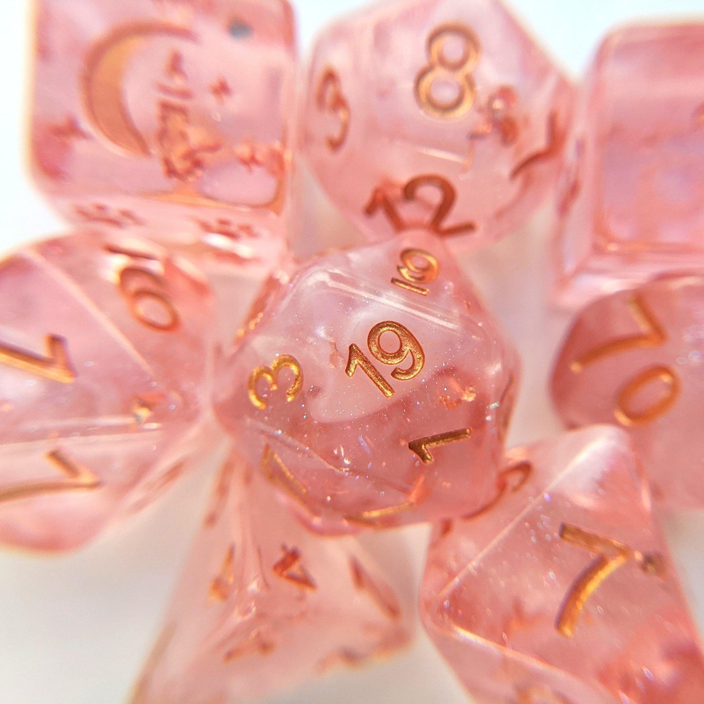 Sakura Cloud 8 piece dice set in light clear pink with copper font, featuring cat wizard and star details, perfect for CozyGamer.
