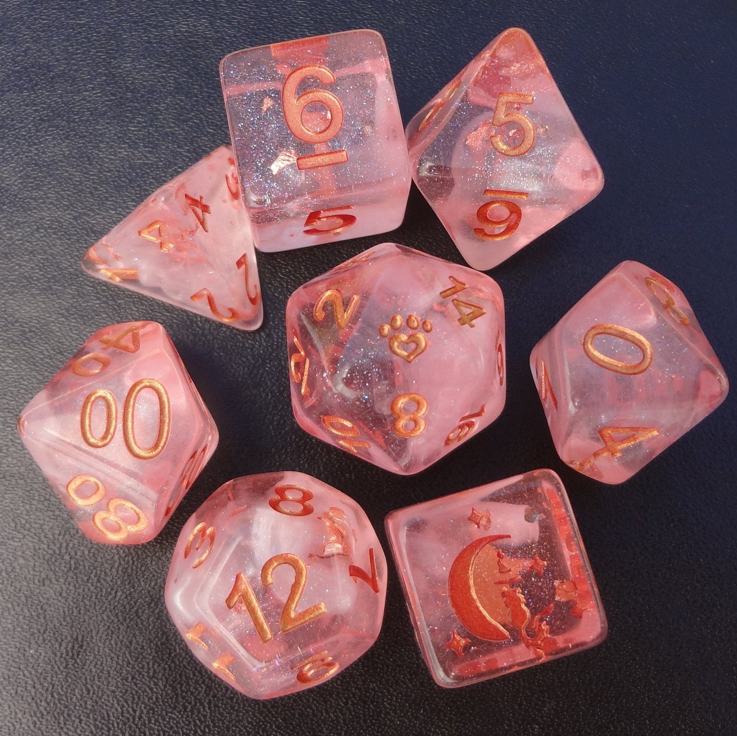 Sakura Cloud 8 piece dice set in light pink resin with copper foil, featuring custom cat wizard, stars, and paw heart design.