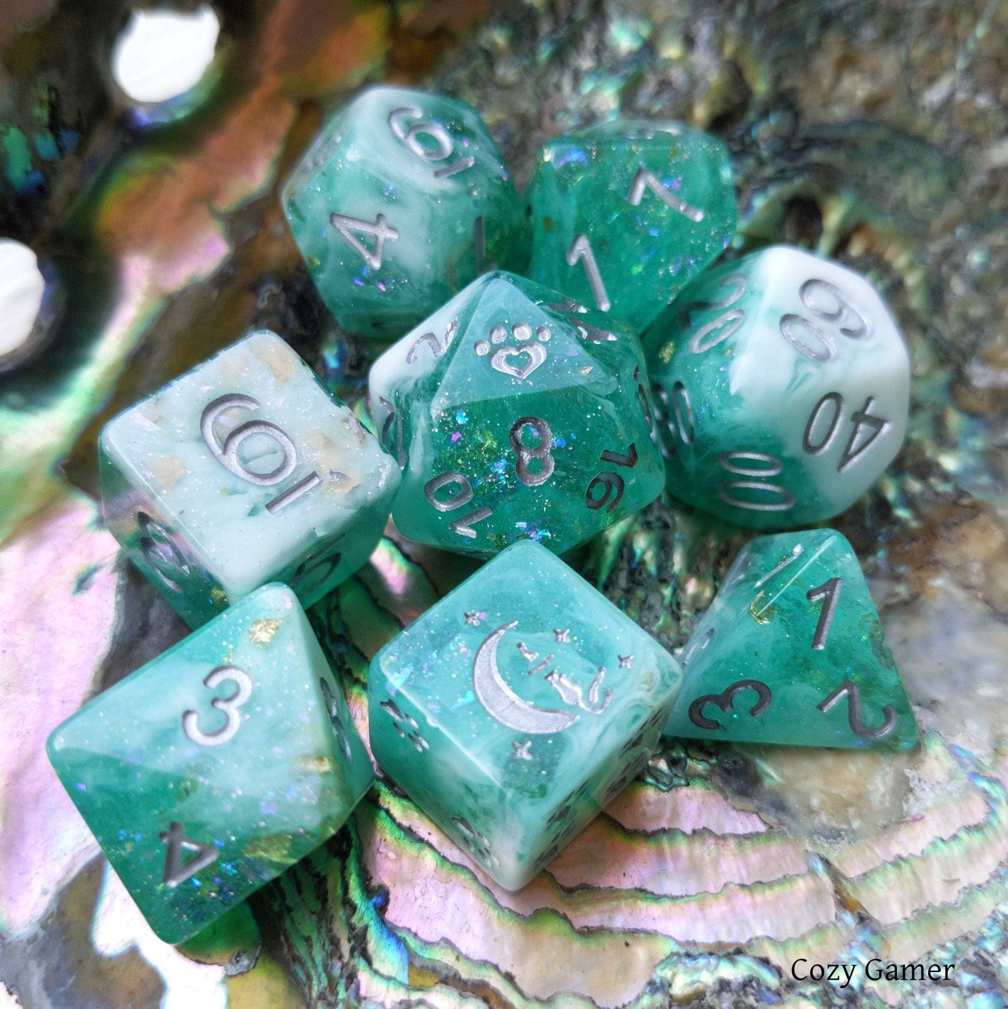 Seafoam 8 piece polyhedral dice set with teal and white marble, glitter, foil accents, and custom cat wizard crescent design.