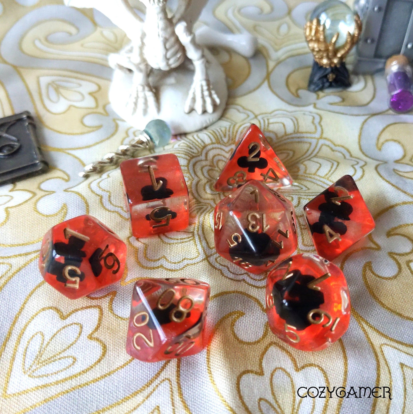 Shape of My Heart Dice Sets, card suit themed 7-piece polyhedral dice for tabletop RPGs, vibrant amber color with black suits.