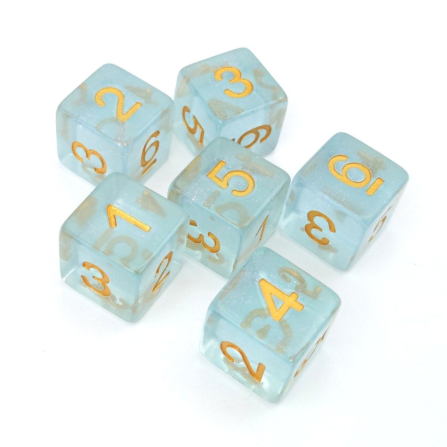 Sleepy Sparkles D6 dice set of six in clear blue resin with gold numbers and micro shimmer, perfect for tabletop games.