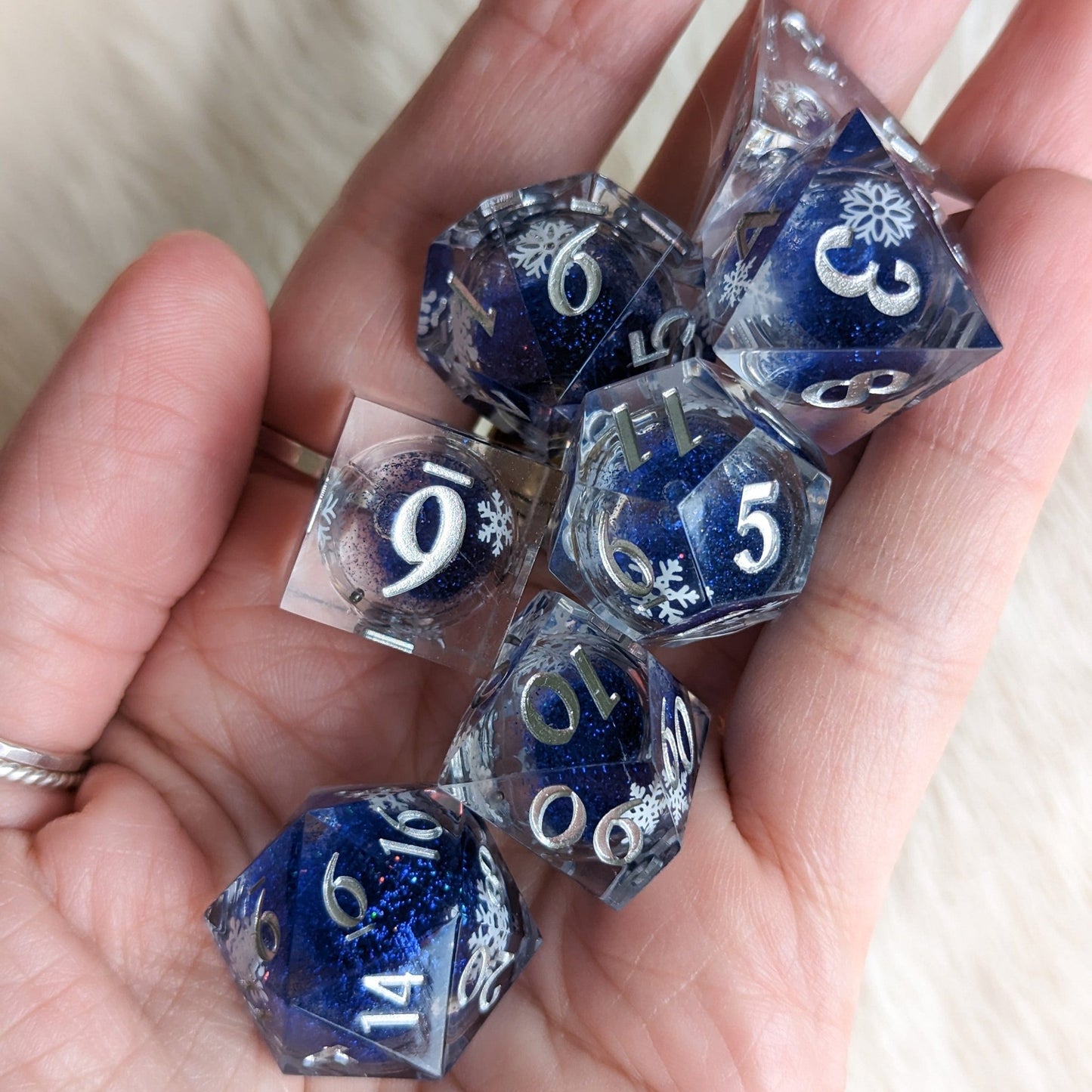 Snowflake Liquid Core Sharp Edge Dice Set – 7 - Piece Blue Glitter DnD Dice - Fennek and Finch