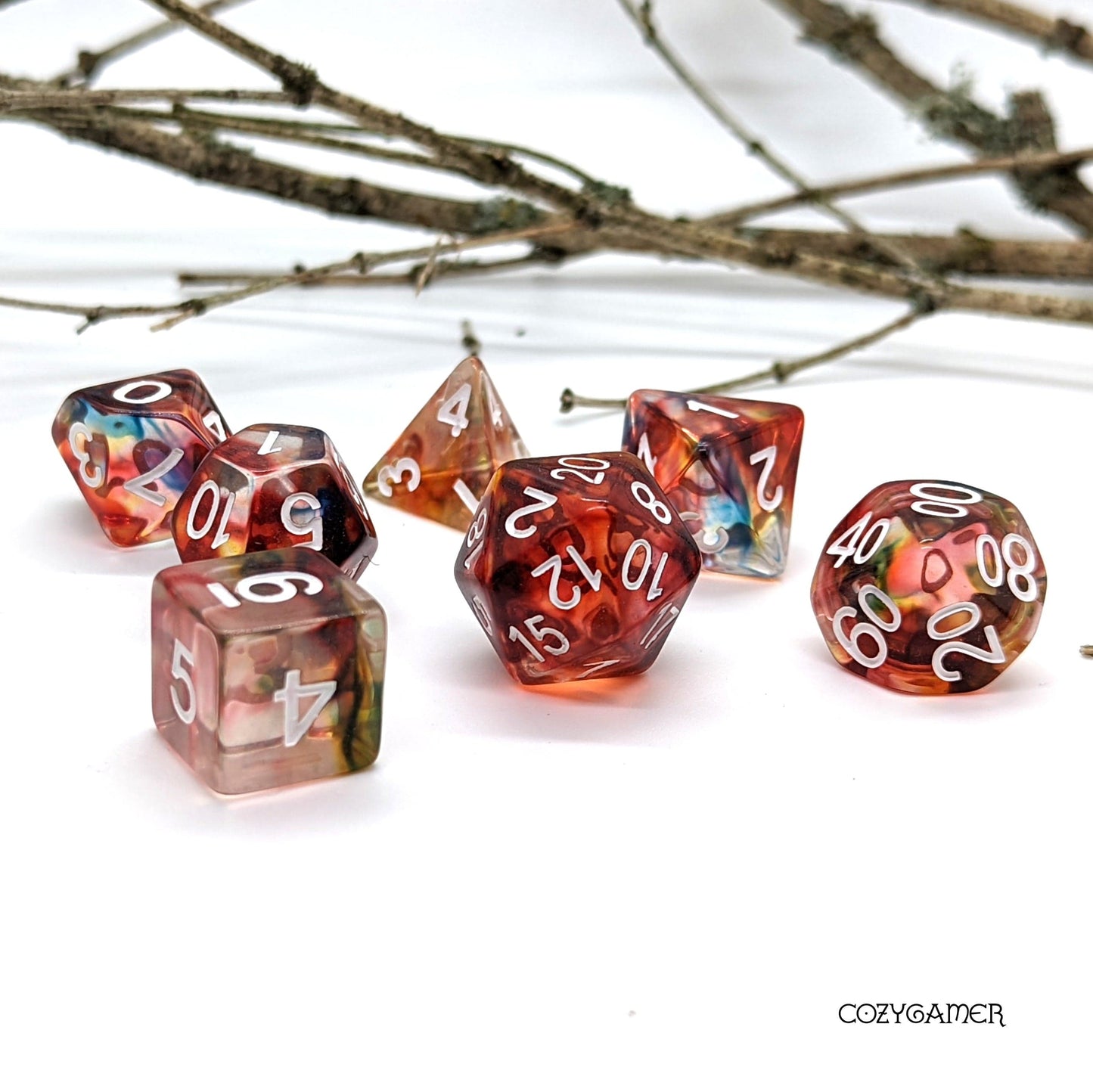 Sorcerer Magic Dice Set with swirling red and blue ink in clear resin, 7 polyhedral pieces for Dungeons and Dragons tabletop games.