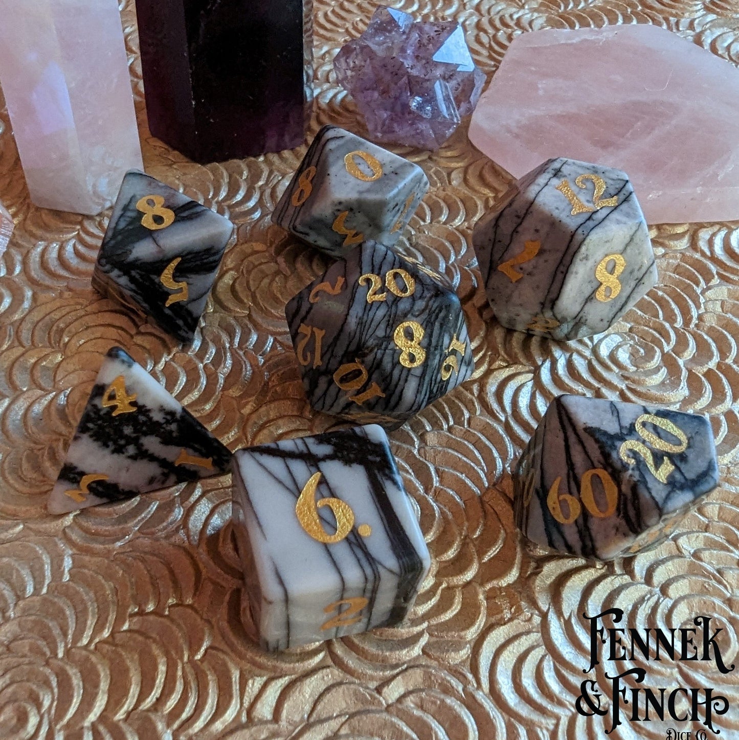 Spider Web Jasper Gemstone Dice Set with gold numbers on a decorative surface, perfect for tabletop RPG enthusiasts.
