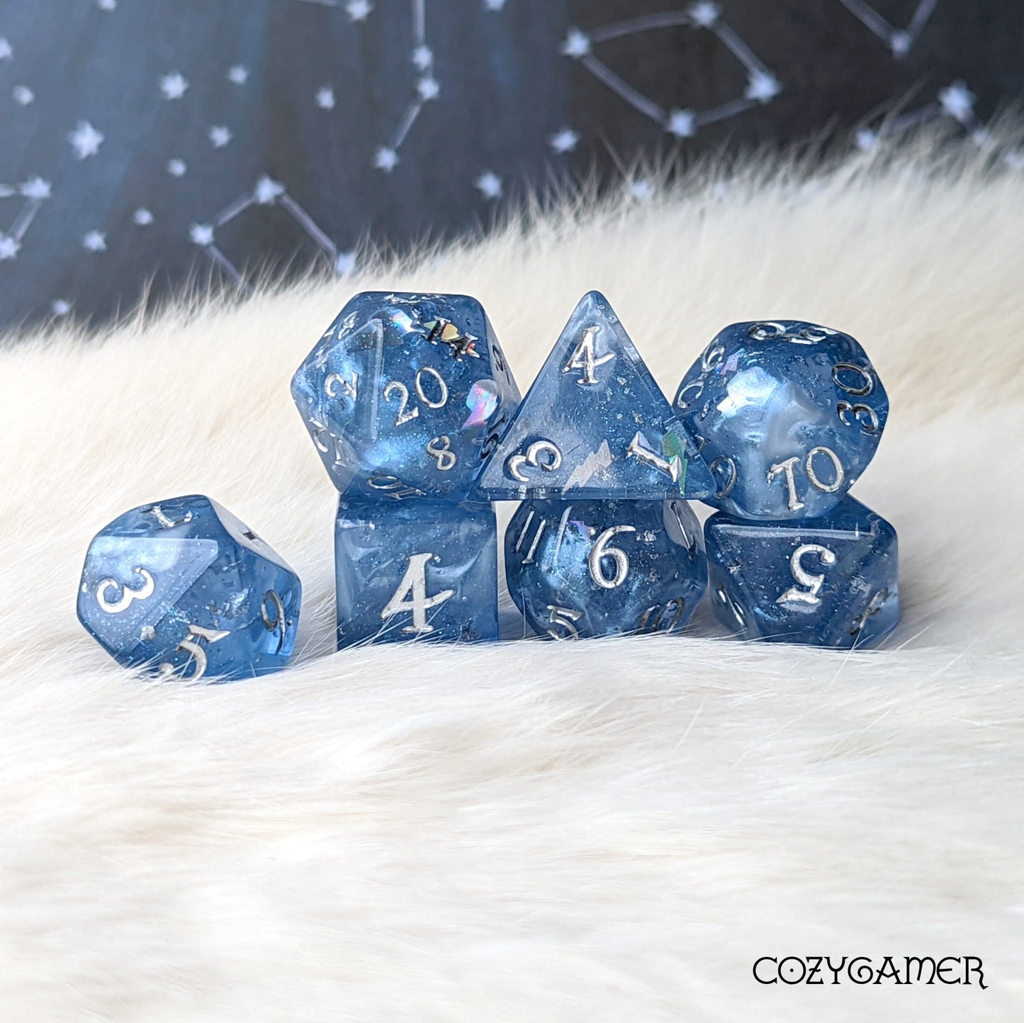 Storm Daddy DnD dice set in deep blue with white clouds, glitter, and holographic lightning displayed on soft fur background.