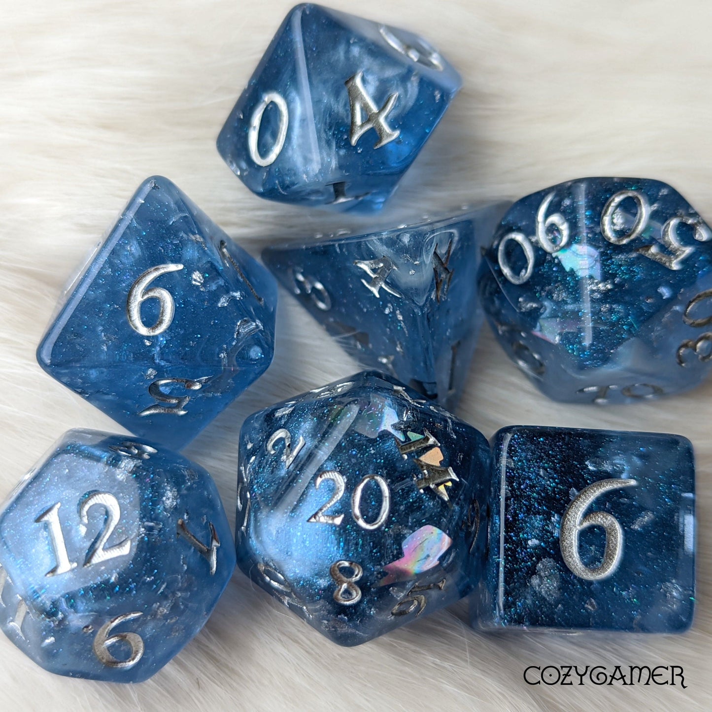 Storm Daddy DnD dice set with metallic silver numbers, deep blue with white clouds, blue glitter, and rainbow holographic lightning.
