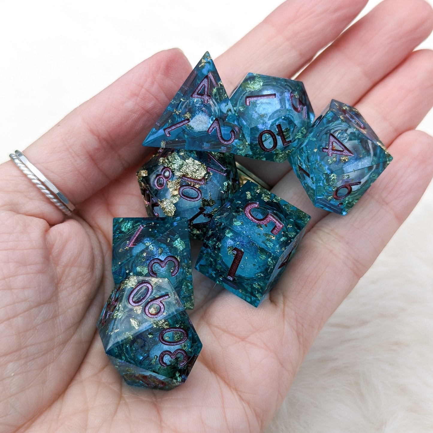 Teal and Gold Liquid Core DnD Dice Set with Swirling Micro Shimmer in Hand