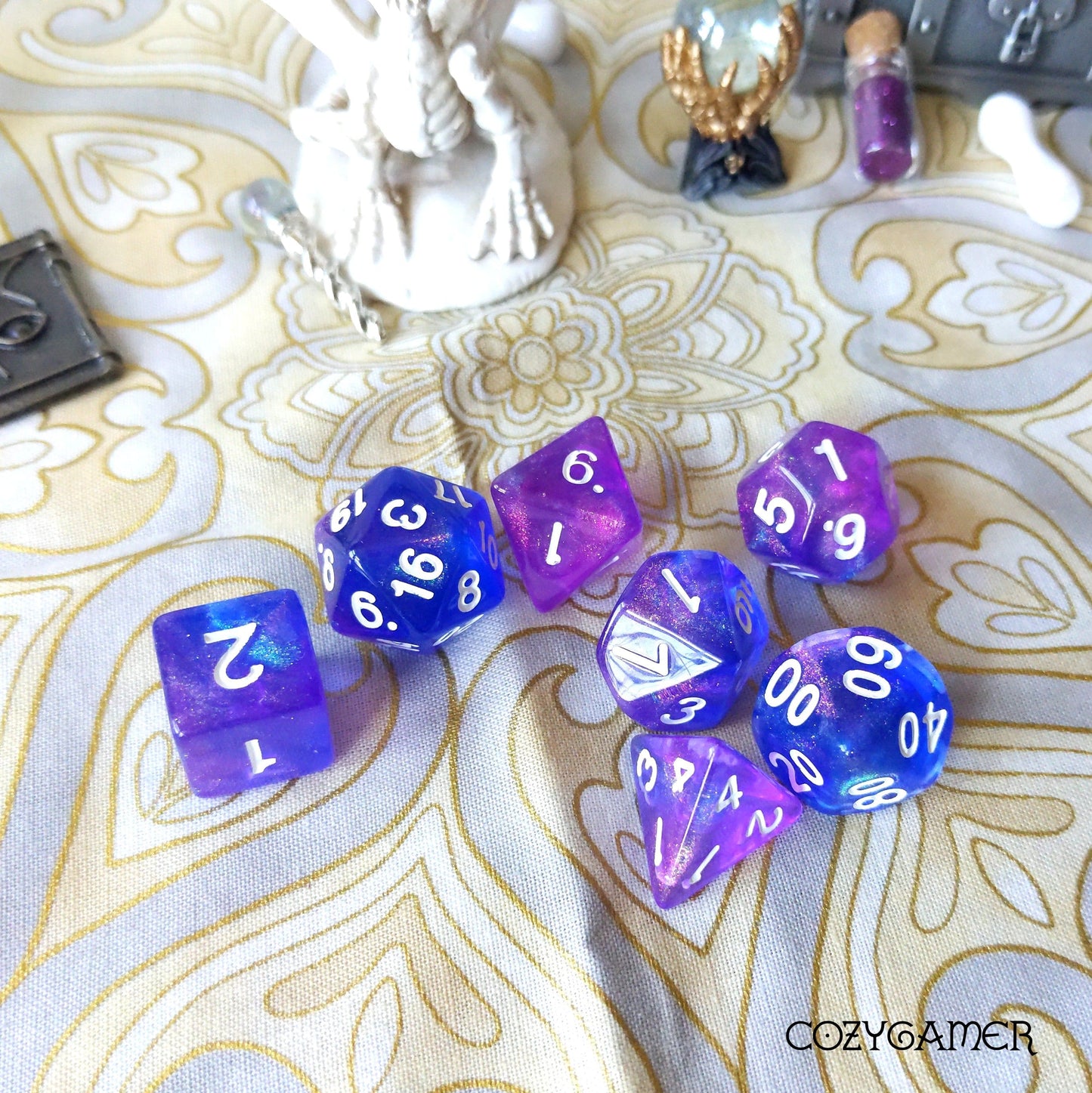 Purple and Blue Galaxy Glitter DND Dice Set for Role Playing Games on Decorative Background