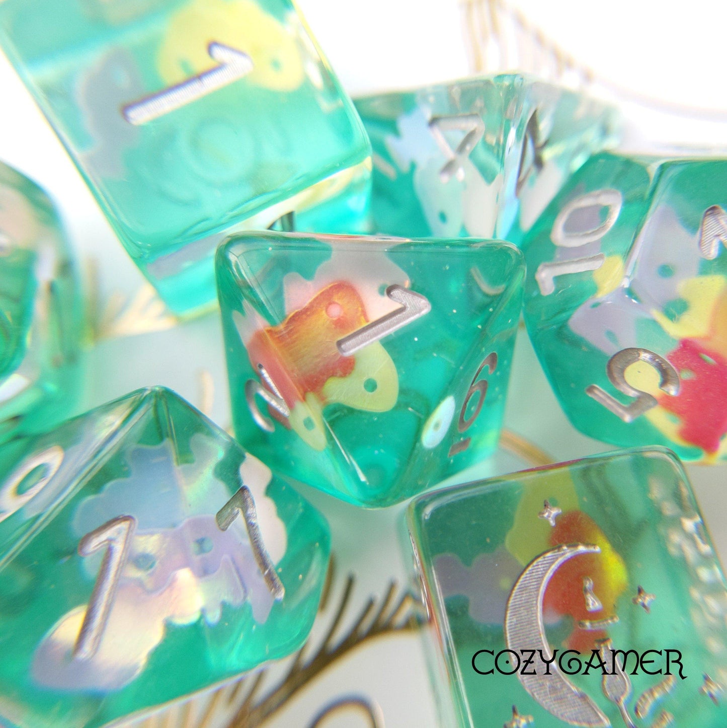 Tropical Fish Dice Set featuring bright water designs with custom cat wizard icon and paw heart, perfect for Dungeons and Dragons.