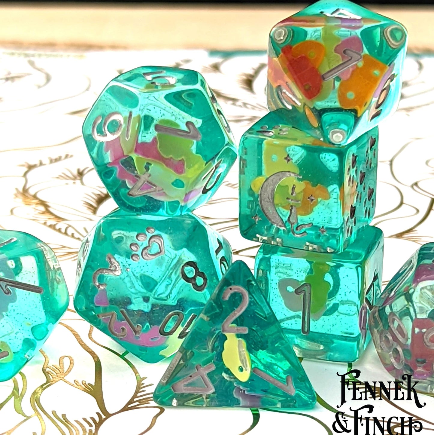 Tropical Fish Dice Set with vivid aquatic patterns, including a custom cat wizard design by Fennek & Finch for tabletop games.