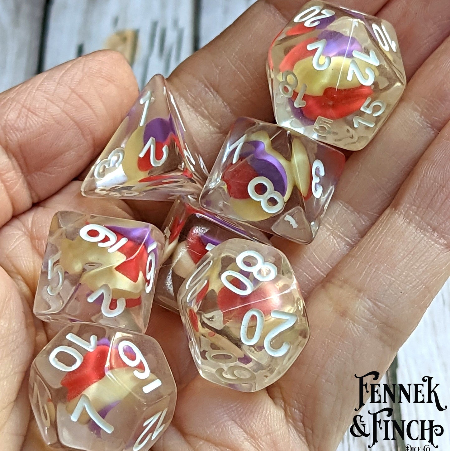 Unicorn Candy Swirl Dice Set with colorful clay candy centers, 7 polyhedral dice for DnD and tabletop role-playing games.