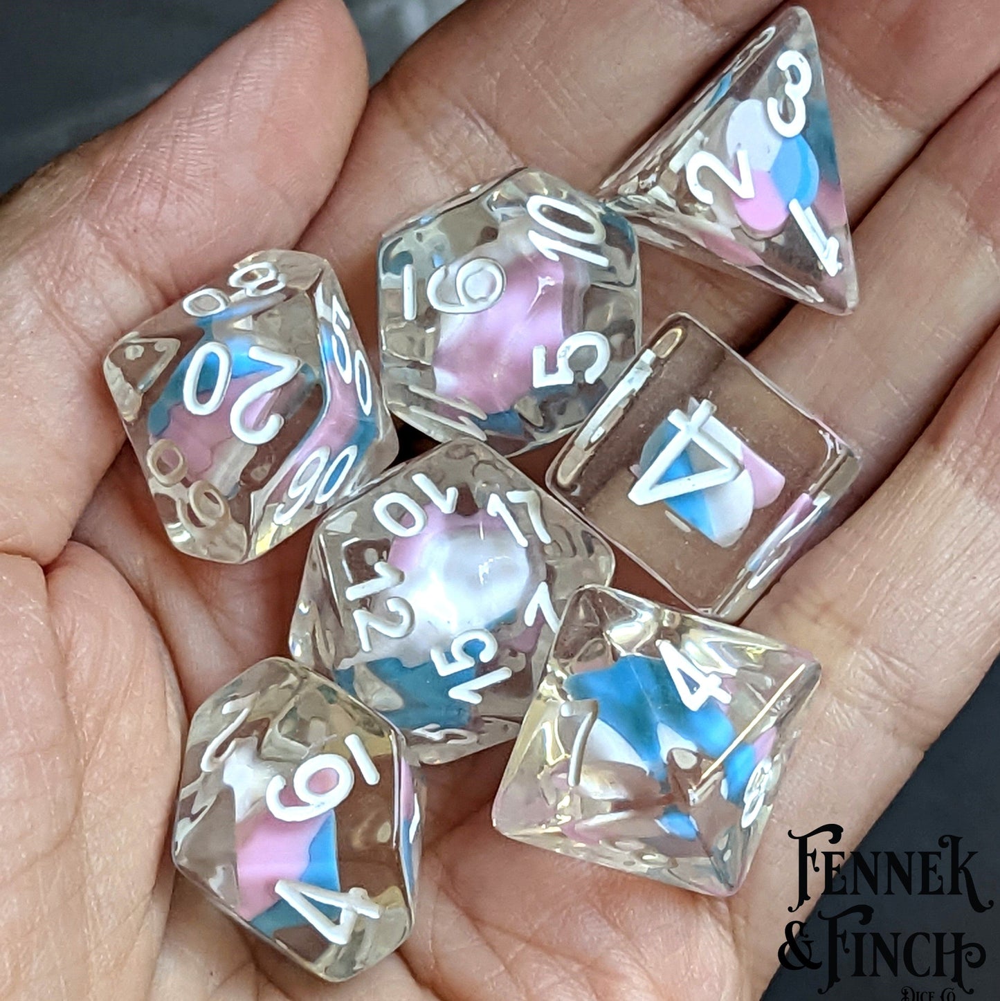 Unicorn Candy Swirl Dice Set for TTRPGs, featuring resin dice with clay candy centers, ideal for Dungeons and Dragons.