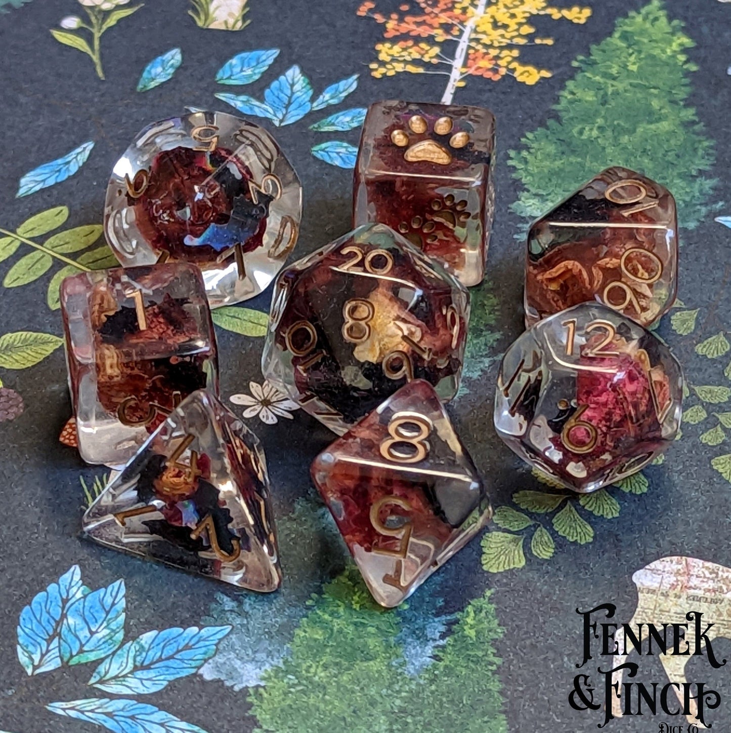 Vampire Romance Dice Set with rose petals and bat glitter on floral background, custom font, for Dungeons and Dragons by Fennek and Finch.
