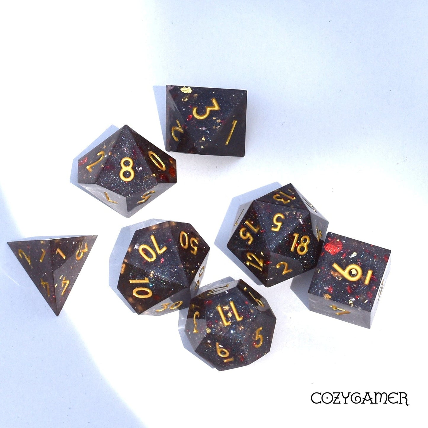 Volcanic Ash Sharp Edge Dice Set. Grey shimmering glitter and red flakes